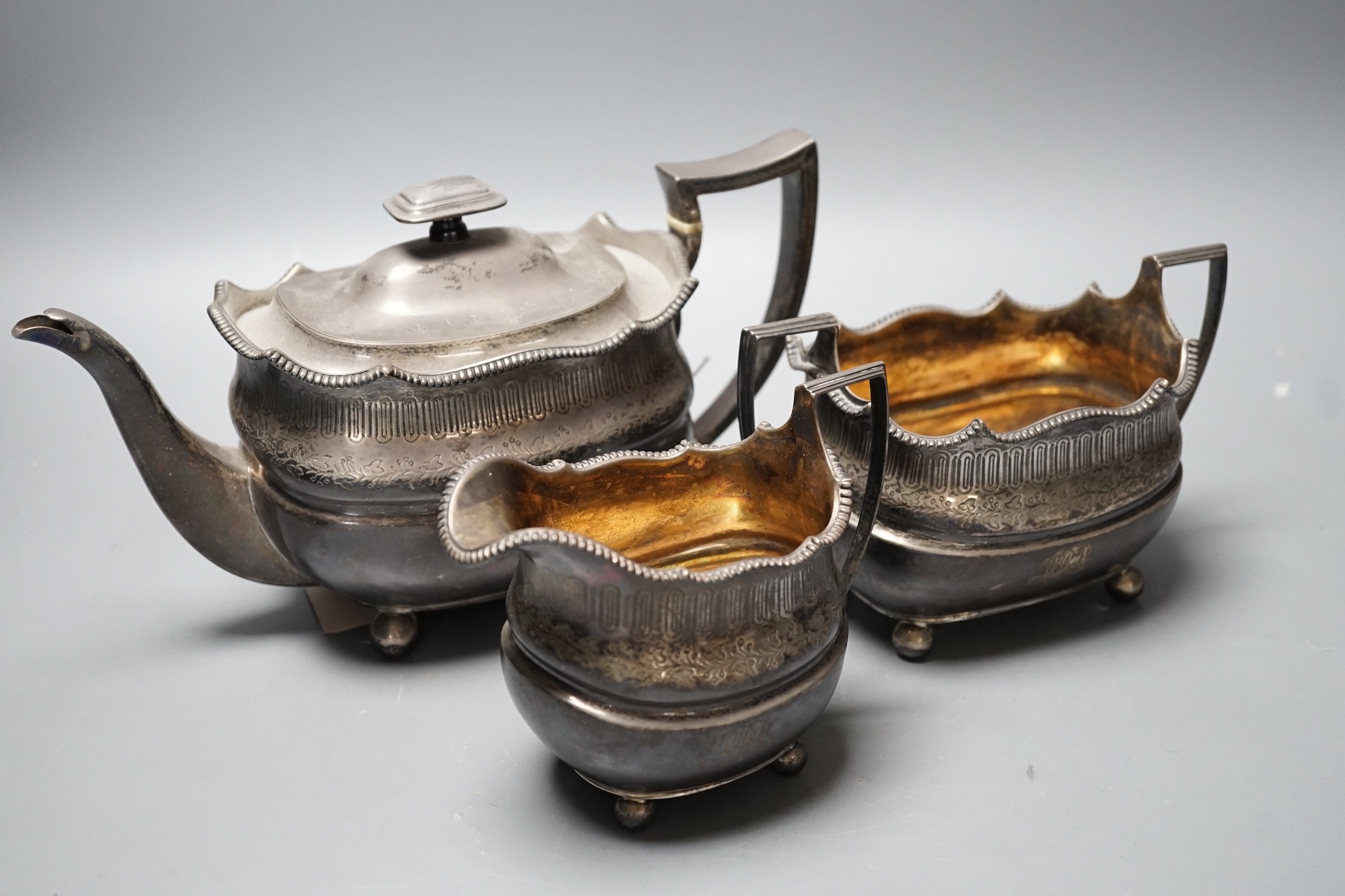A George III Scottish silver three piece tea set, George McHattie, Edinburgh, 1809, 36.4oz.                                                                                                                                 