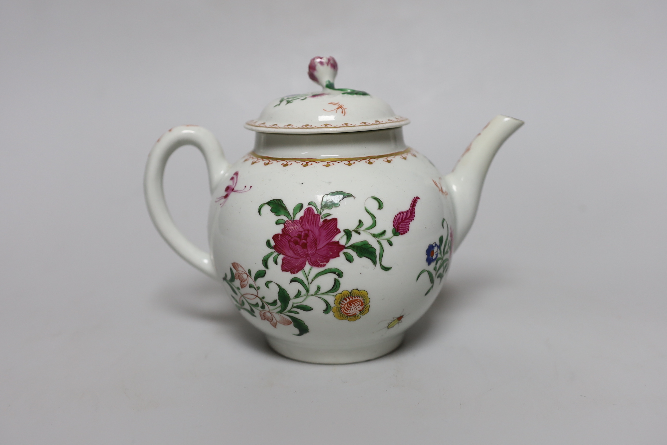 A Worcester teapot and cover, painted with Chinese style flowers and winged insects, c.1770, 14cm tall                                                                                                                      