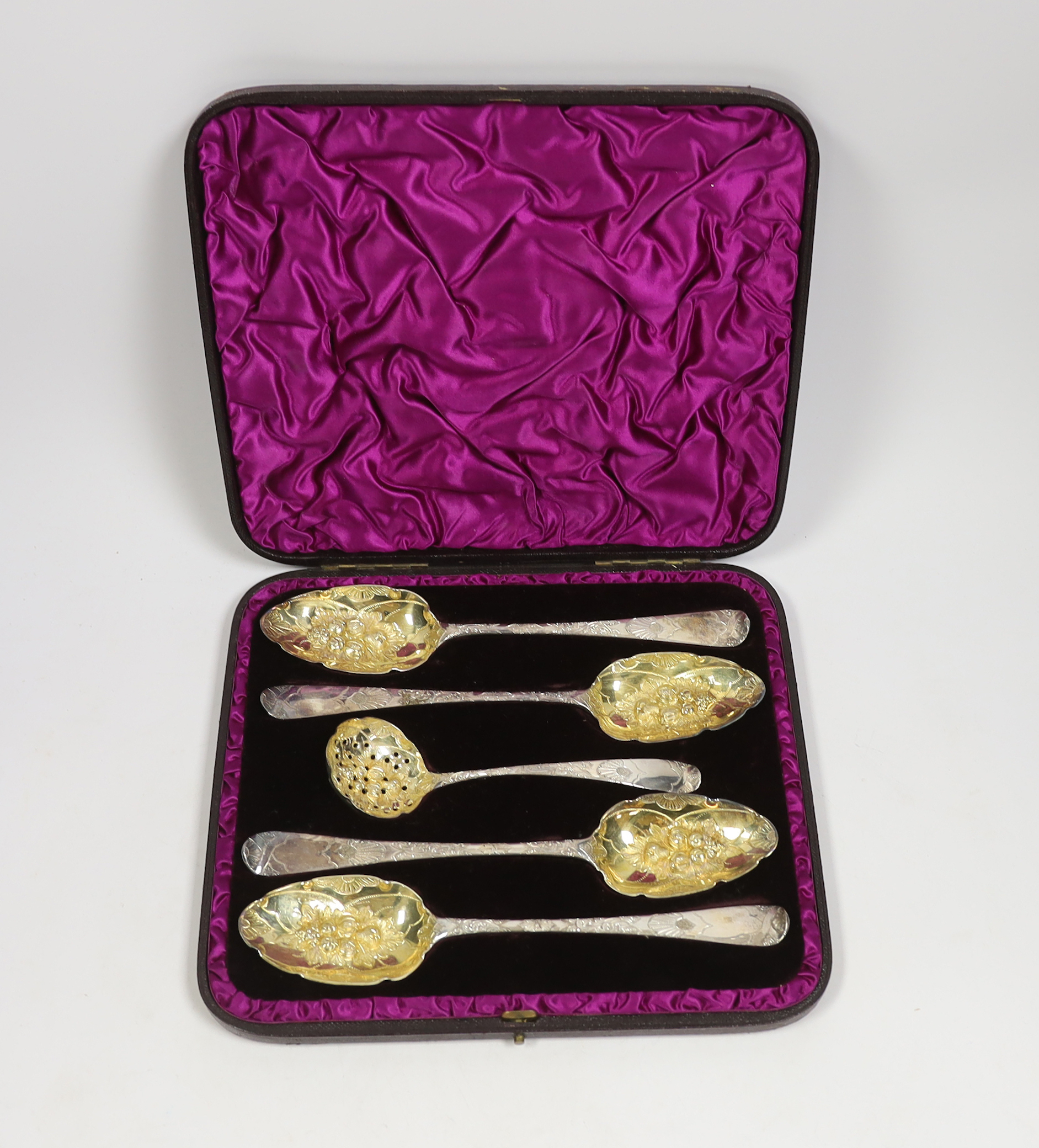 A cased George III matched silver five piece serving and sifter berry spoon set, two spoons by Eley, Fearn & Chawner, London, 1809, serving spoon 22cm.                                                                     