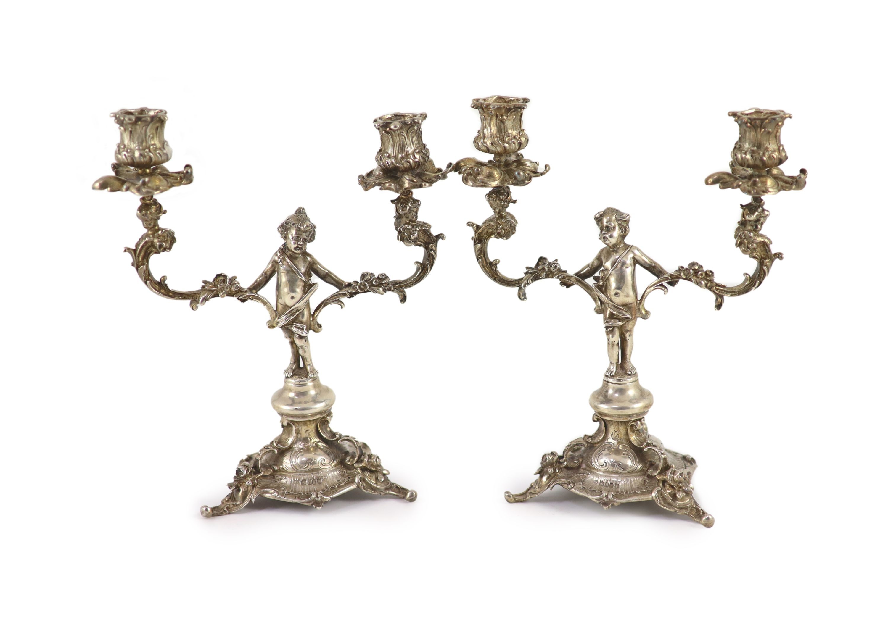 A pair of late Victorian silver two light, two branch candelabra                                                                                                                                                            