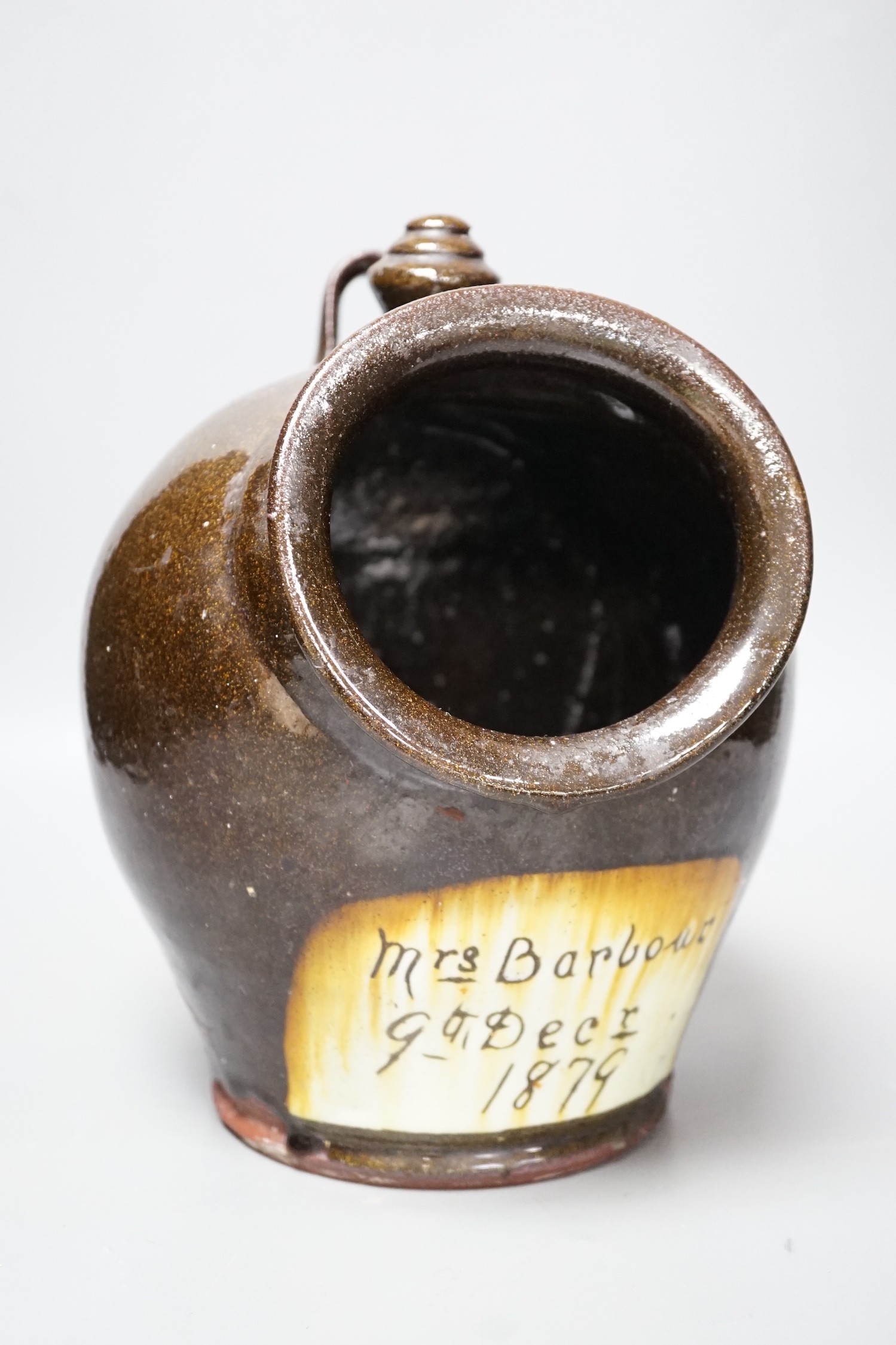 A glazed stoneware salt dispenser, inscribed in slip Mrs Barbour 9th Decr. 1879, 25cm                                                                                                                                       