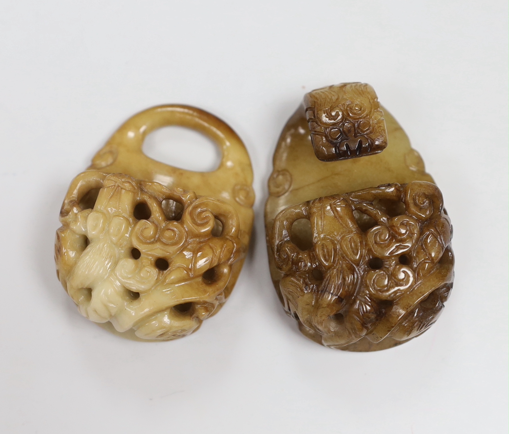 A Chinese cream and russet jade two piece belt buckle, 17th century                                                                                                                                                         