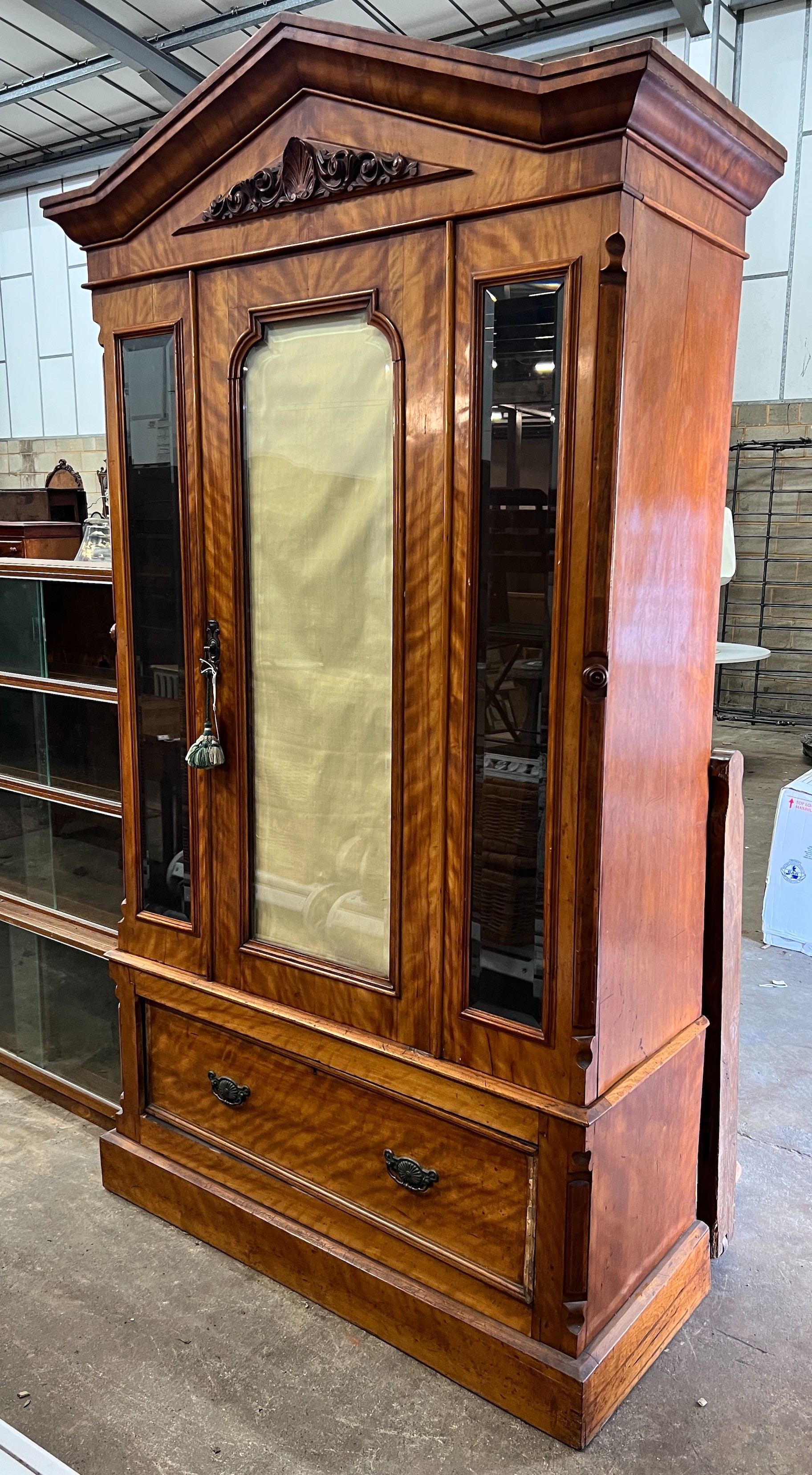 A Victorian satin birch wardrobe with bevelled glass front, length 124cm, depth 51cm, height 222cm *Please note the sale commences at 9am.                                                                                  