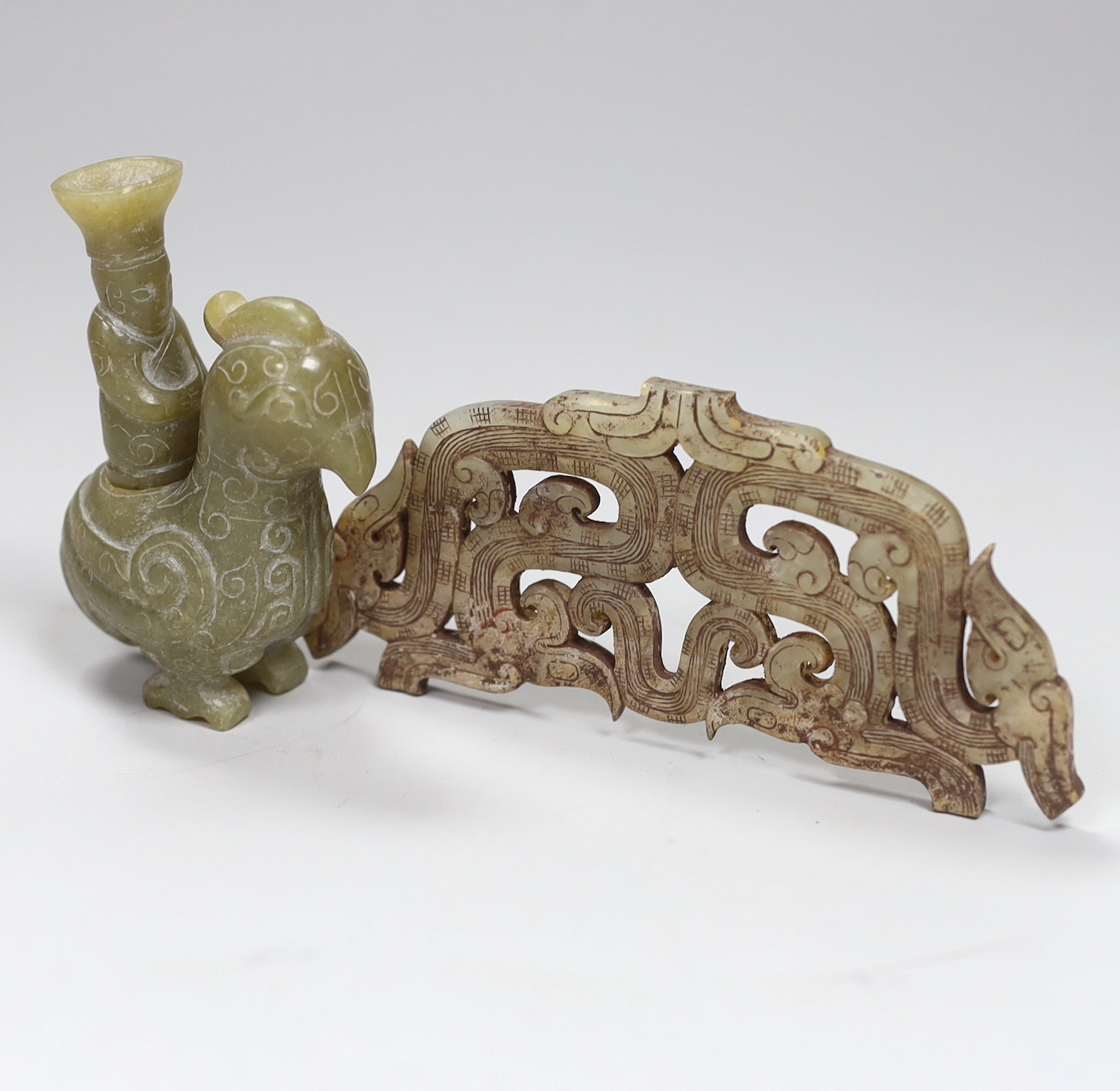 A Chinese archaistic jade plaque and an archaistic jade two figure group, plaque 13.4cm                                                                                                                                     