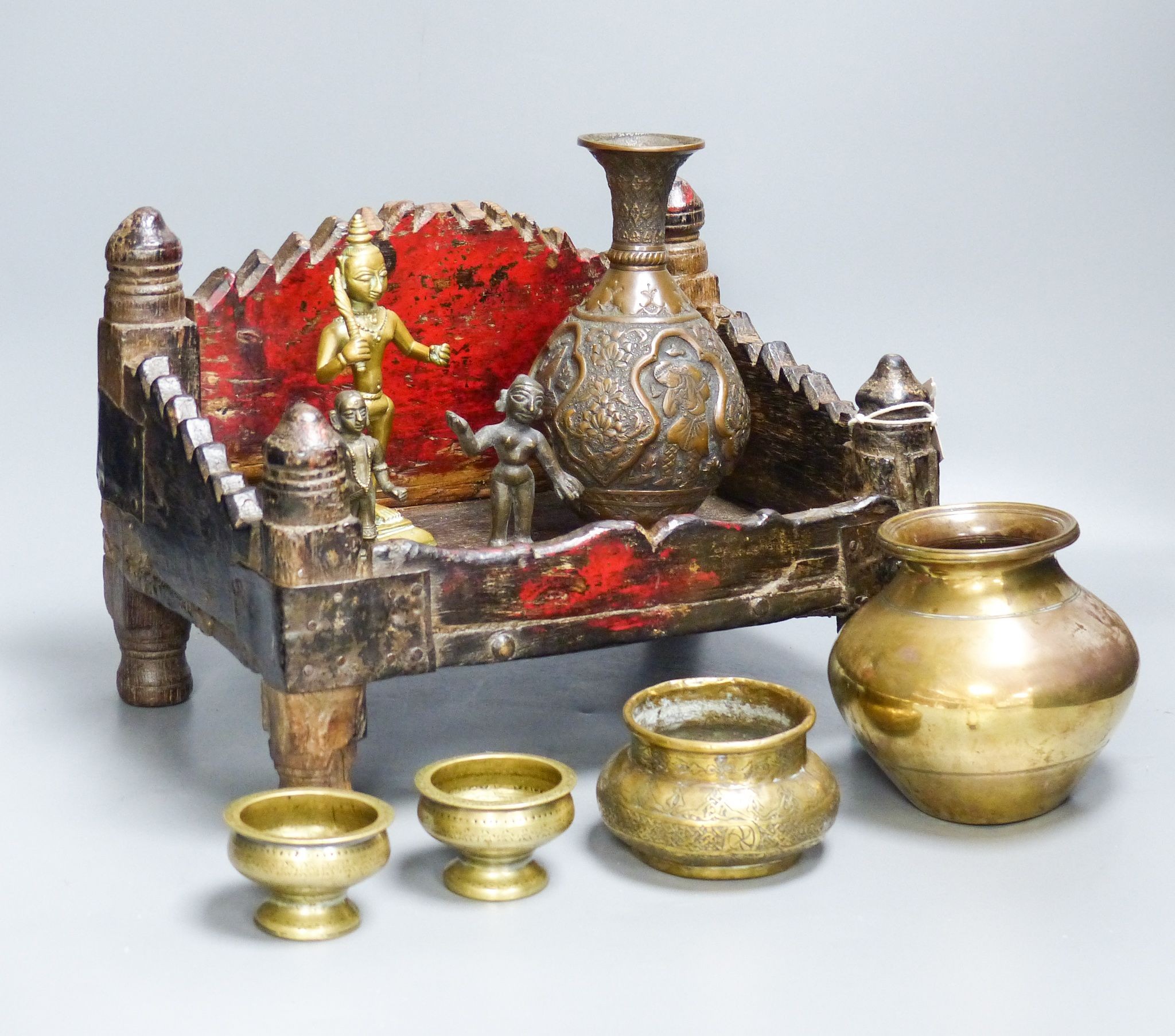 An Indian shrine stand, metalware figures and vessels (9), stand 29.5 cm wide                                                                                                                                               