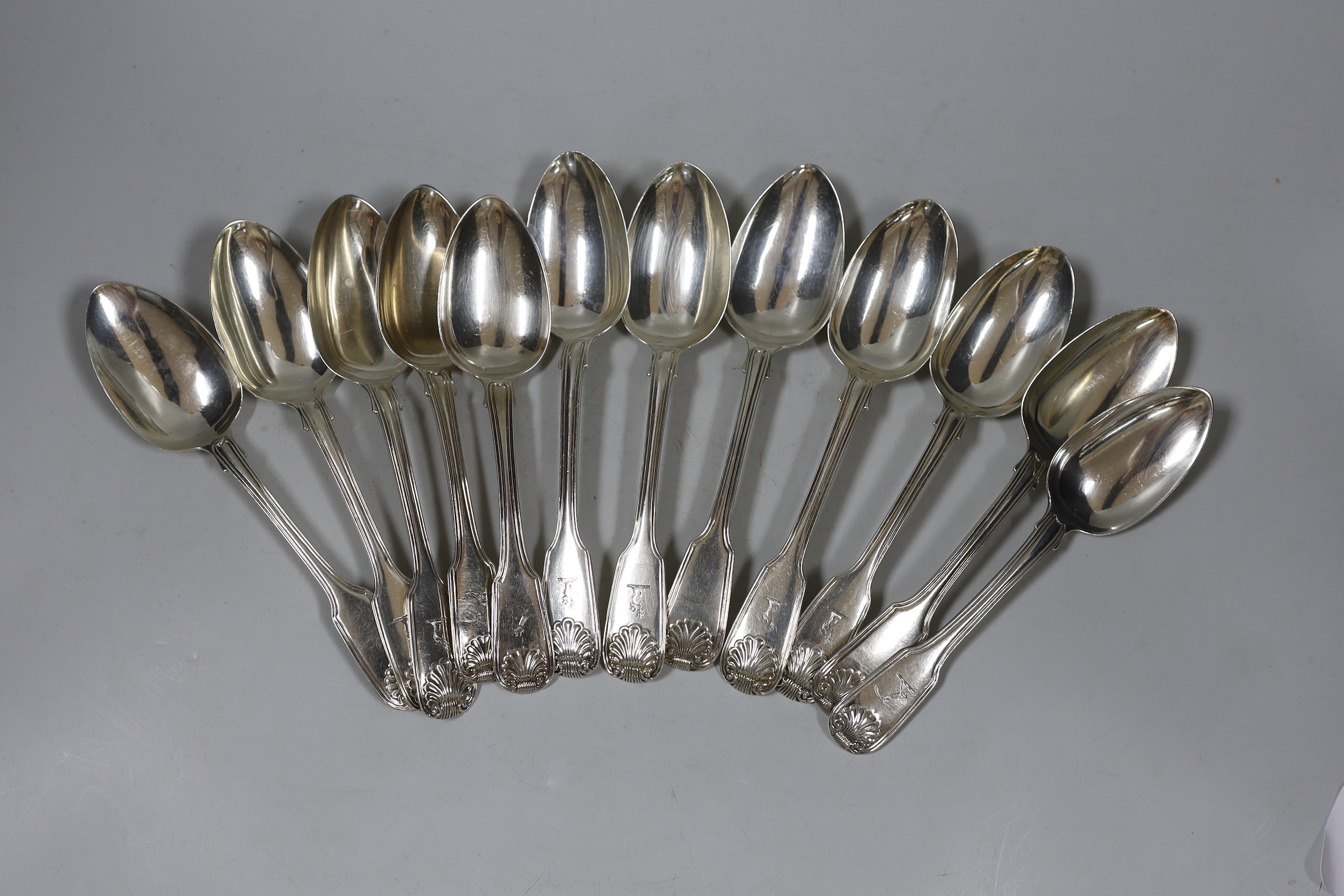 A set of six Victorian silver fiddle, thread and shell pattern dessert spoons, George Wintle, London, 1853 and six similar dessert spoons, 18.3oz.                                                                          