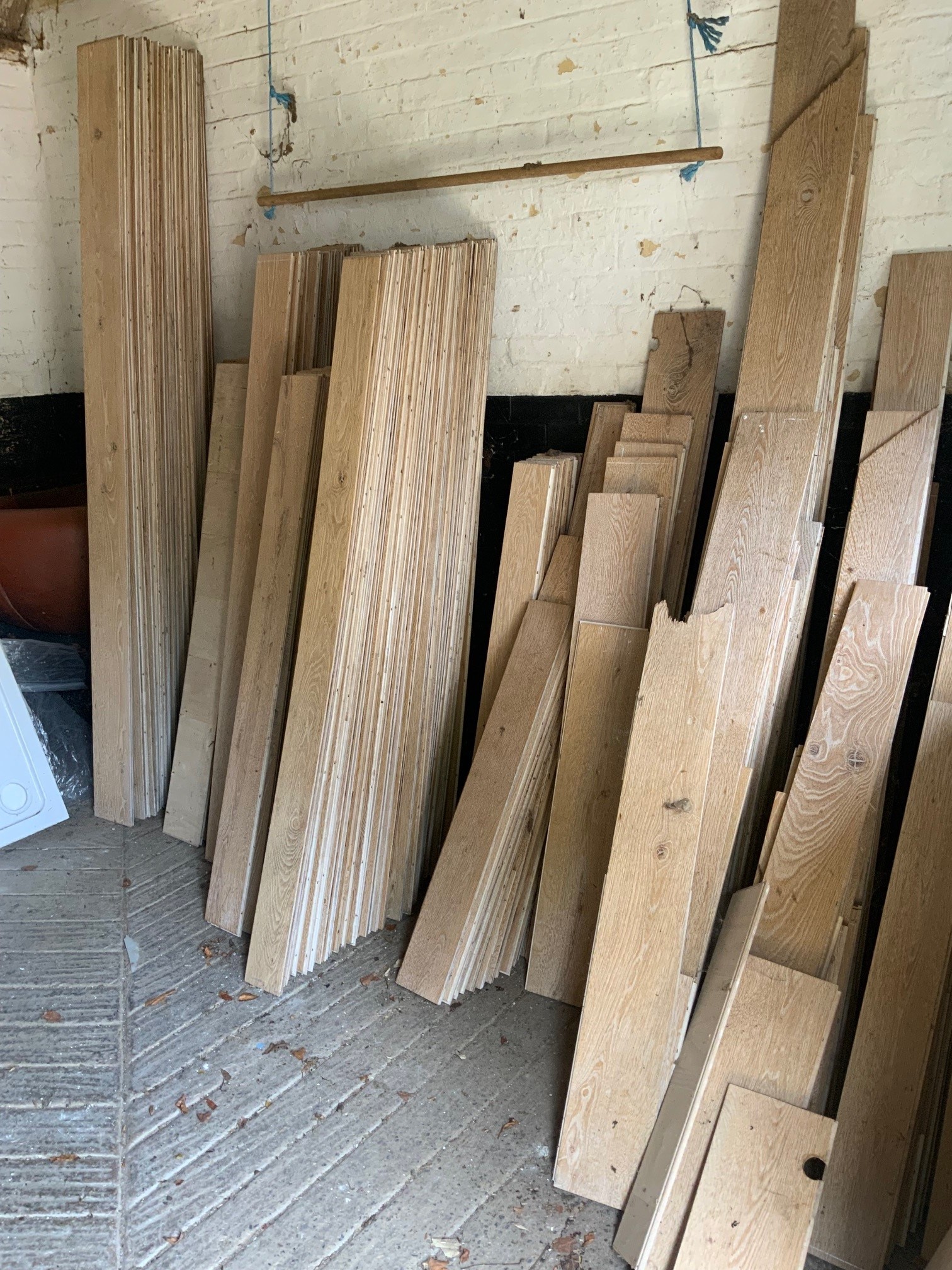 A quantity of engineered light oak floor boarding of various lengths, widths mainly 19cm and 13cm, all 1.5cm thick. As previously fitted to four rooms - 679 x 633cm; 551 x 367cm; 437 x 396cm and 376 x 321cm (approx. 93. 