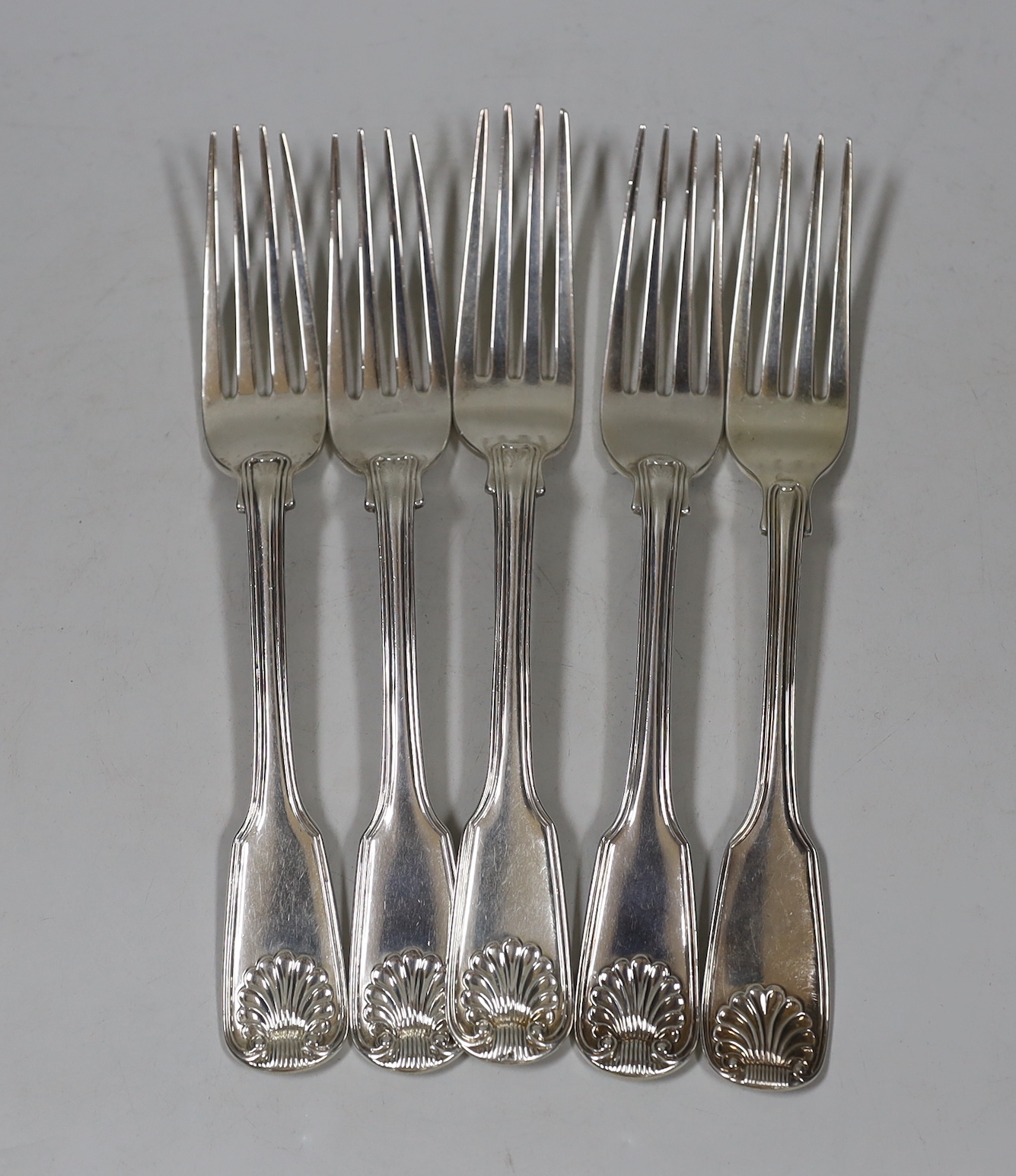 A harlequin set of five George IV/William IV silver fiddle, thread and shell pattern table forks, various dates and makers, 12.6oz.                                                                                         