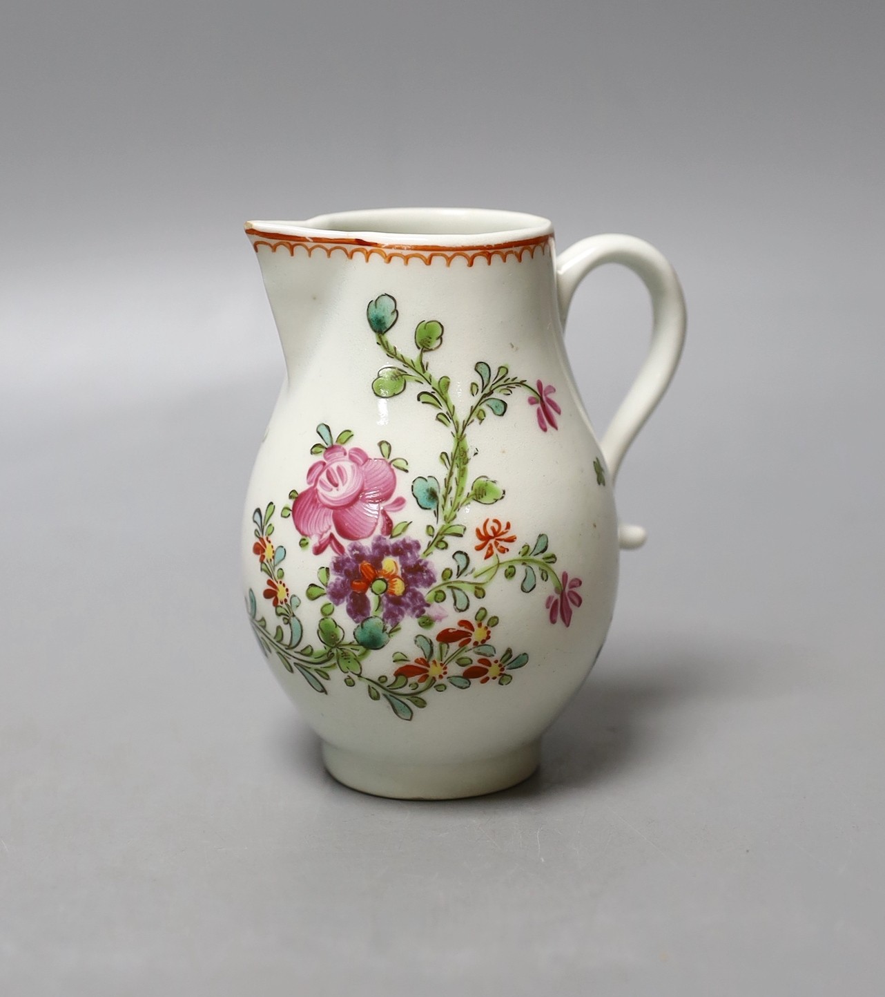 Lowestoft sparrow beak jug painted with a floral spray and scattered sprigs c.1780 - 9.5cm high                                                                                                                             