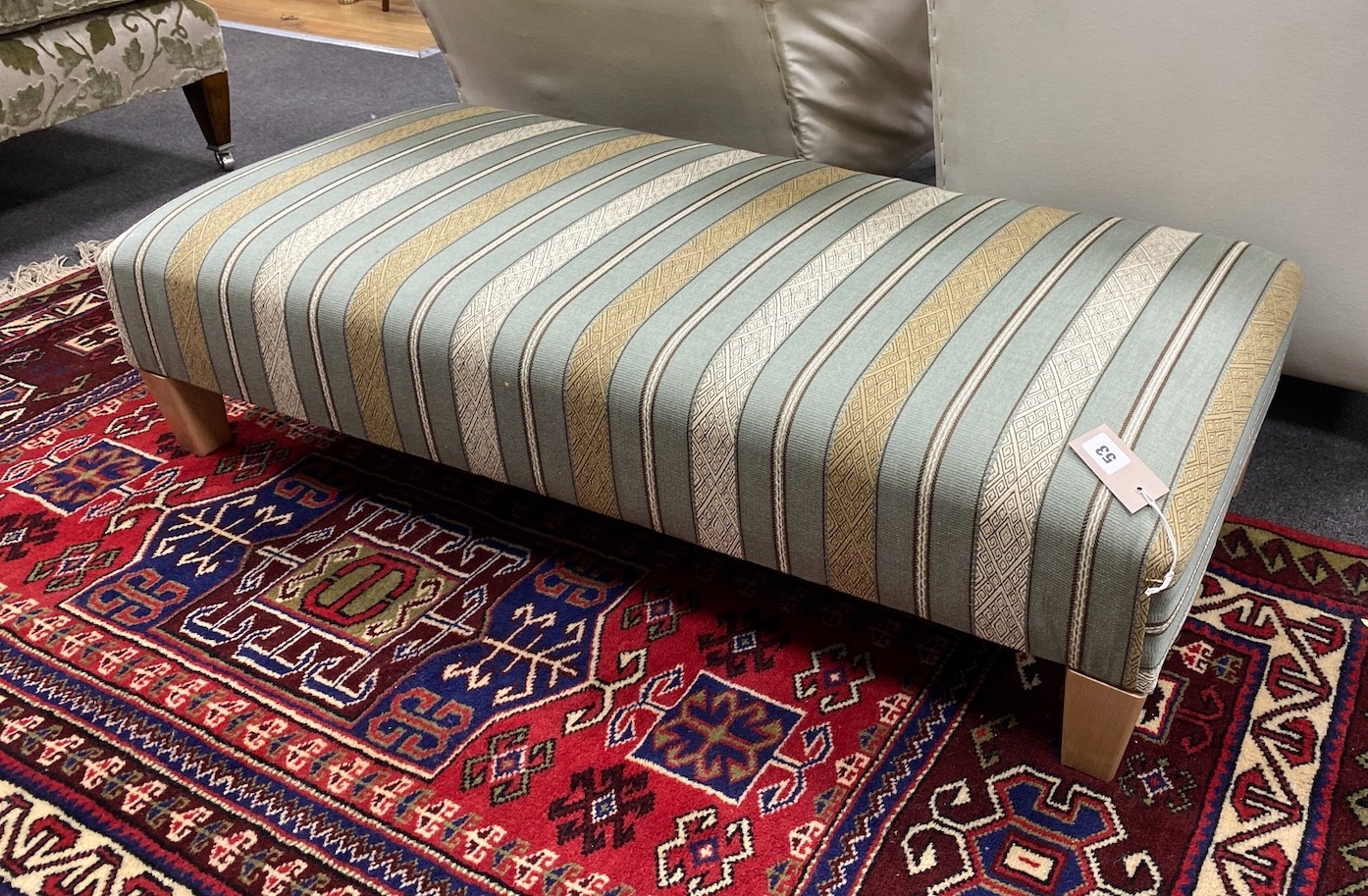 A contemporary rectangular footstool upholstered in Kravet stripe fabric width 117cm, depth 56cm, height 28cm                                                                                                               