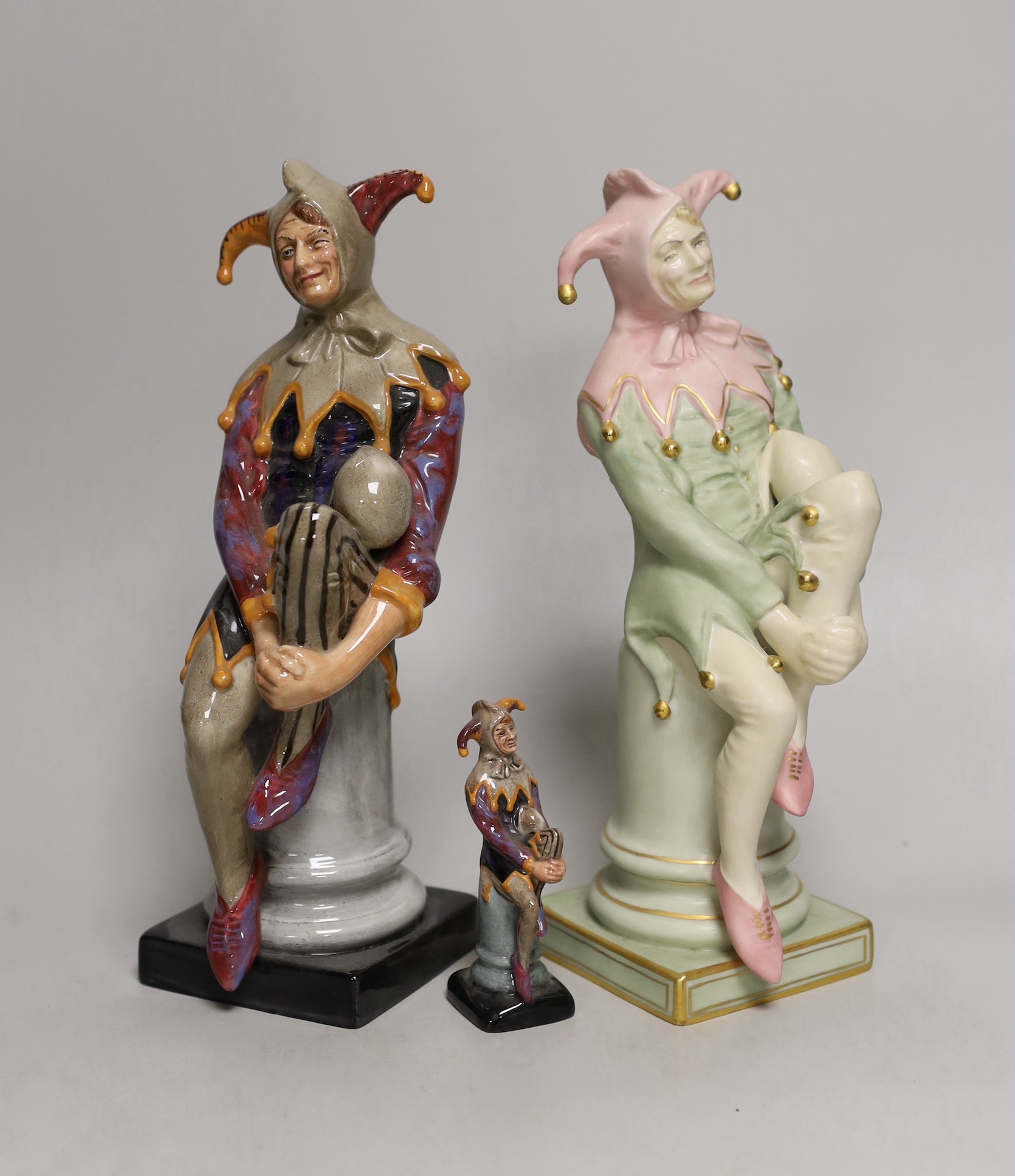 Three Royal Doulton figures, Jester, HN3922 150/950, HN2016 and HN3335 (miniature). Tallest 25cm                                                                                                                            