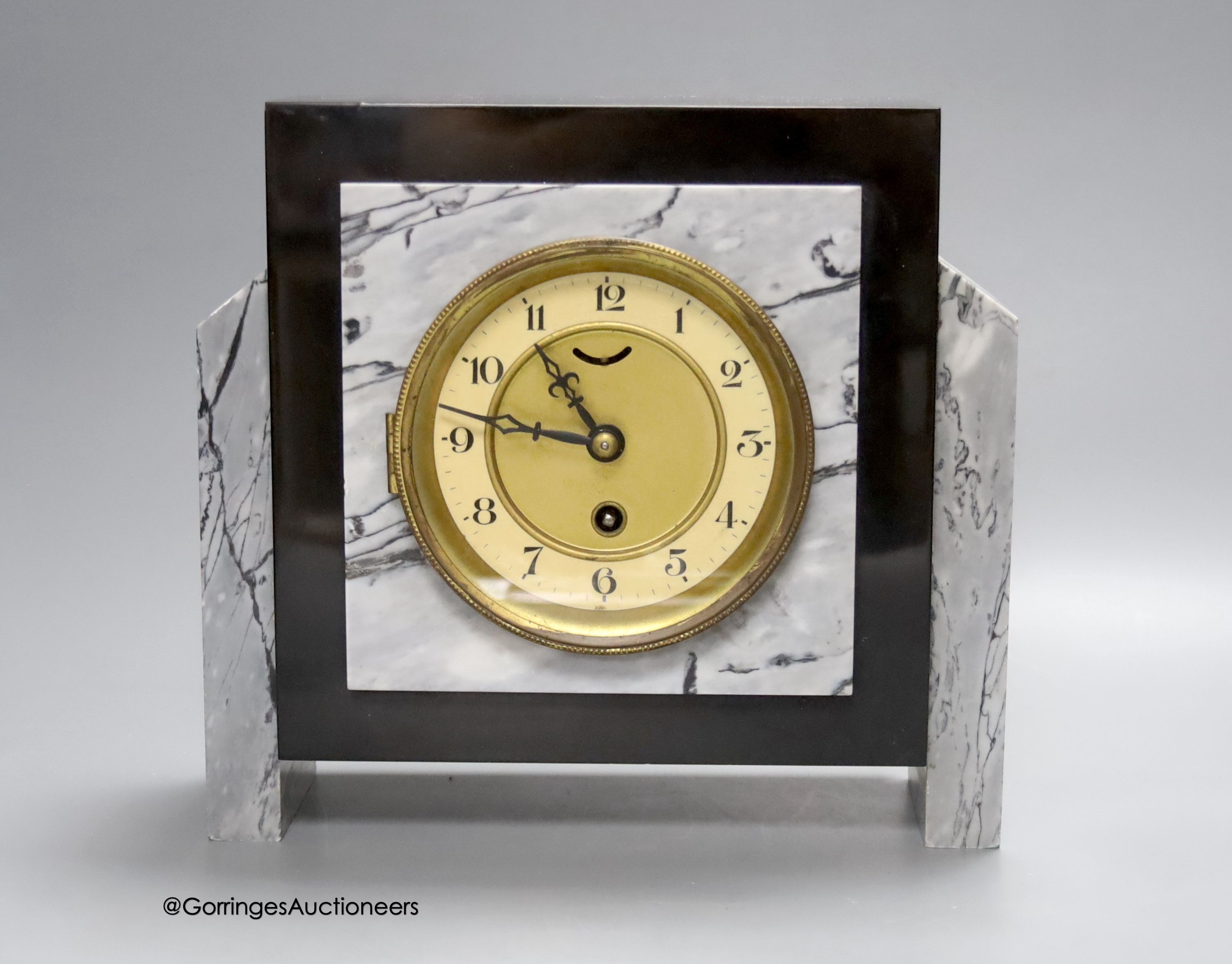 A stepped grey marble/slate mantle clock                                                                                                                                                                                    