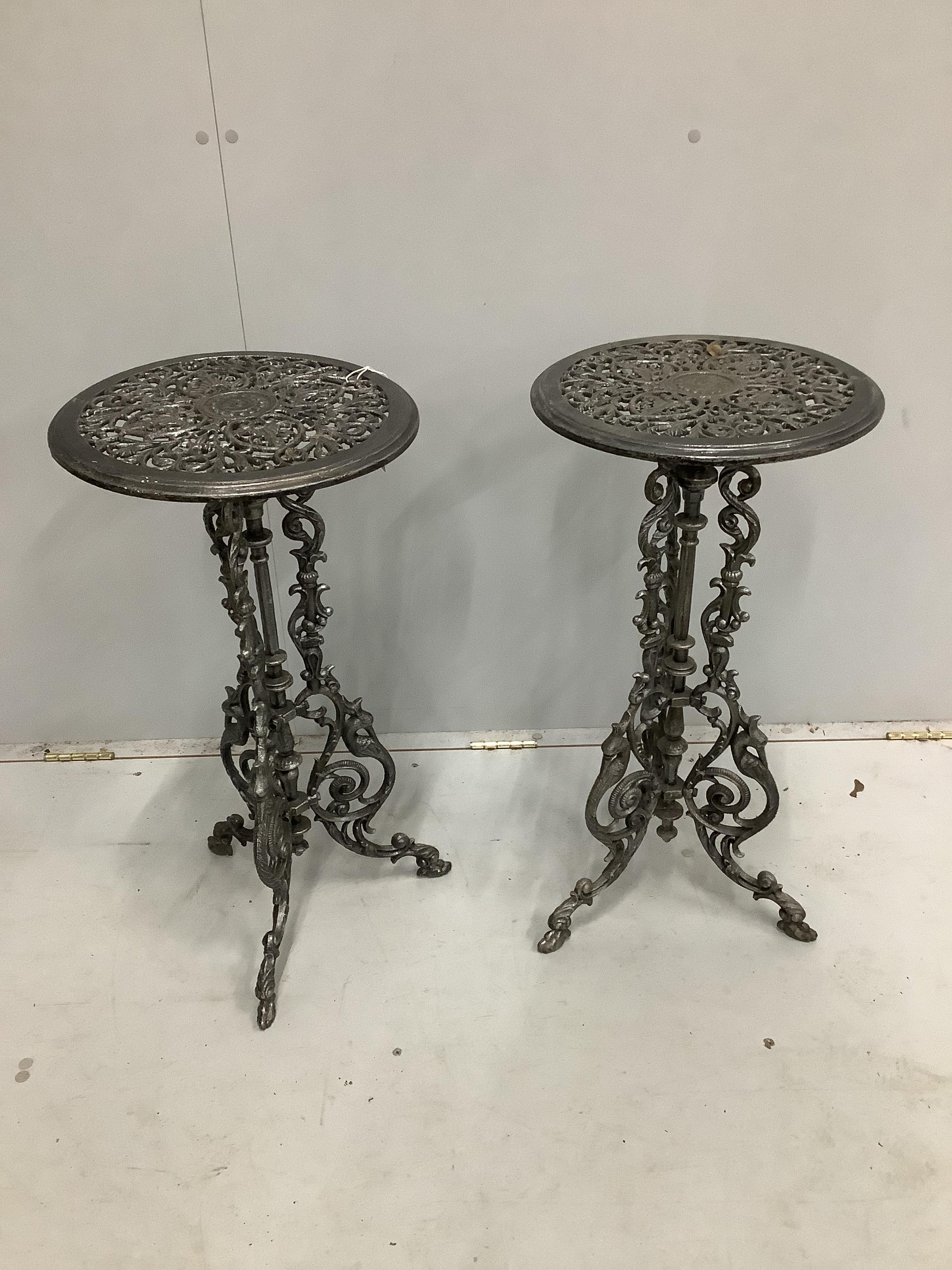 A pair of Victorian style circular cast metal tripod tables, diameter 36cm, height 72cm                                                                                                                                     