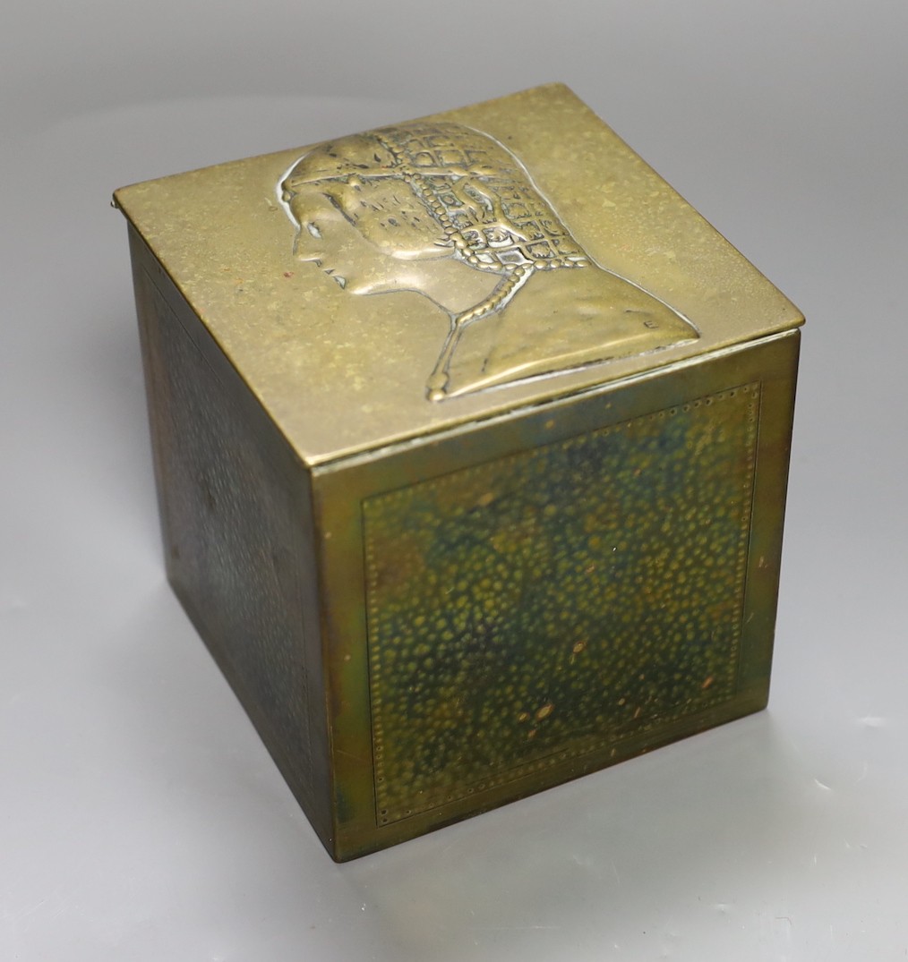 A lead lined planished brass tobacco jar with figural cover, H - 12cm, W - 12cm, D - 12cm                                                                                                                                   