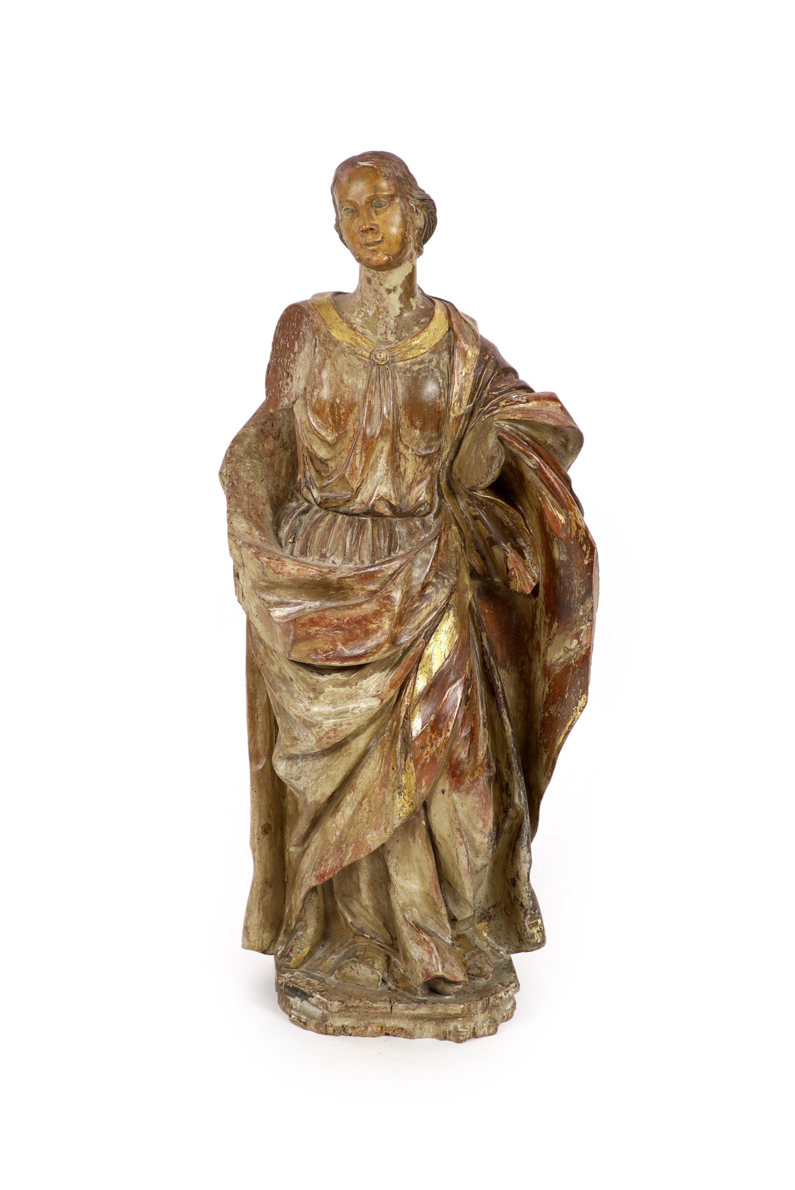 An 18th century Spanish carved wood figure of a female saint 110cm.                                                                                                                                                         