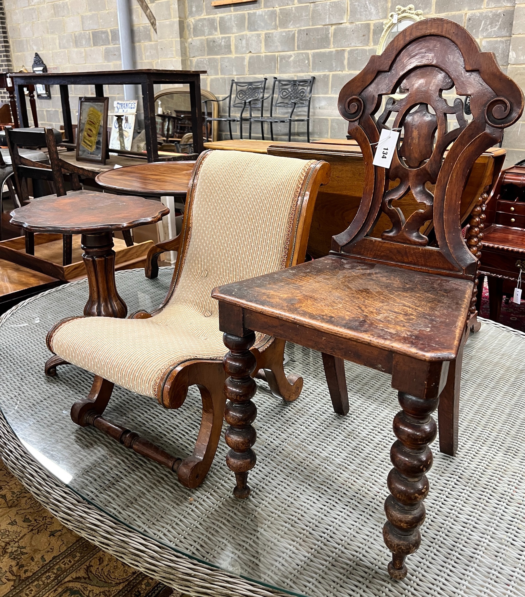 A Victorian oak and mahogany hall chair, a slipper chair and a wine table                                                                                                                                                   
