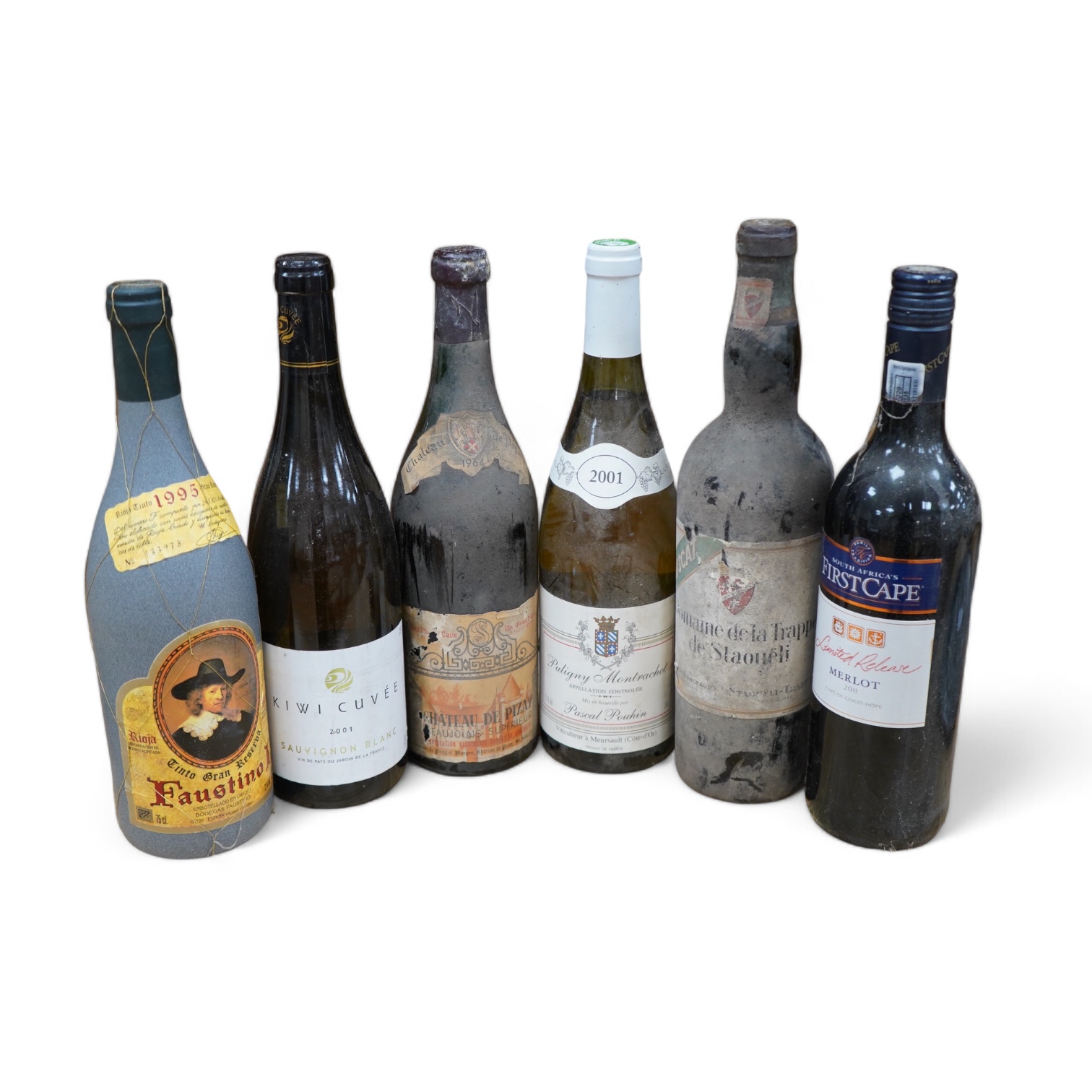 Six bottles of mixed wine to include; a bottle of Muscat, Domaine de La Trappe, a bottle of Puligny Montrachet 2001, a bottle of Chateau de Pizarro Beaujolais Superieur 1964 and two other later bottles of wine. Condition