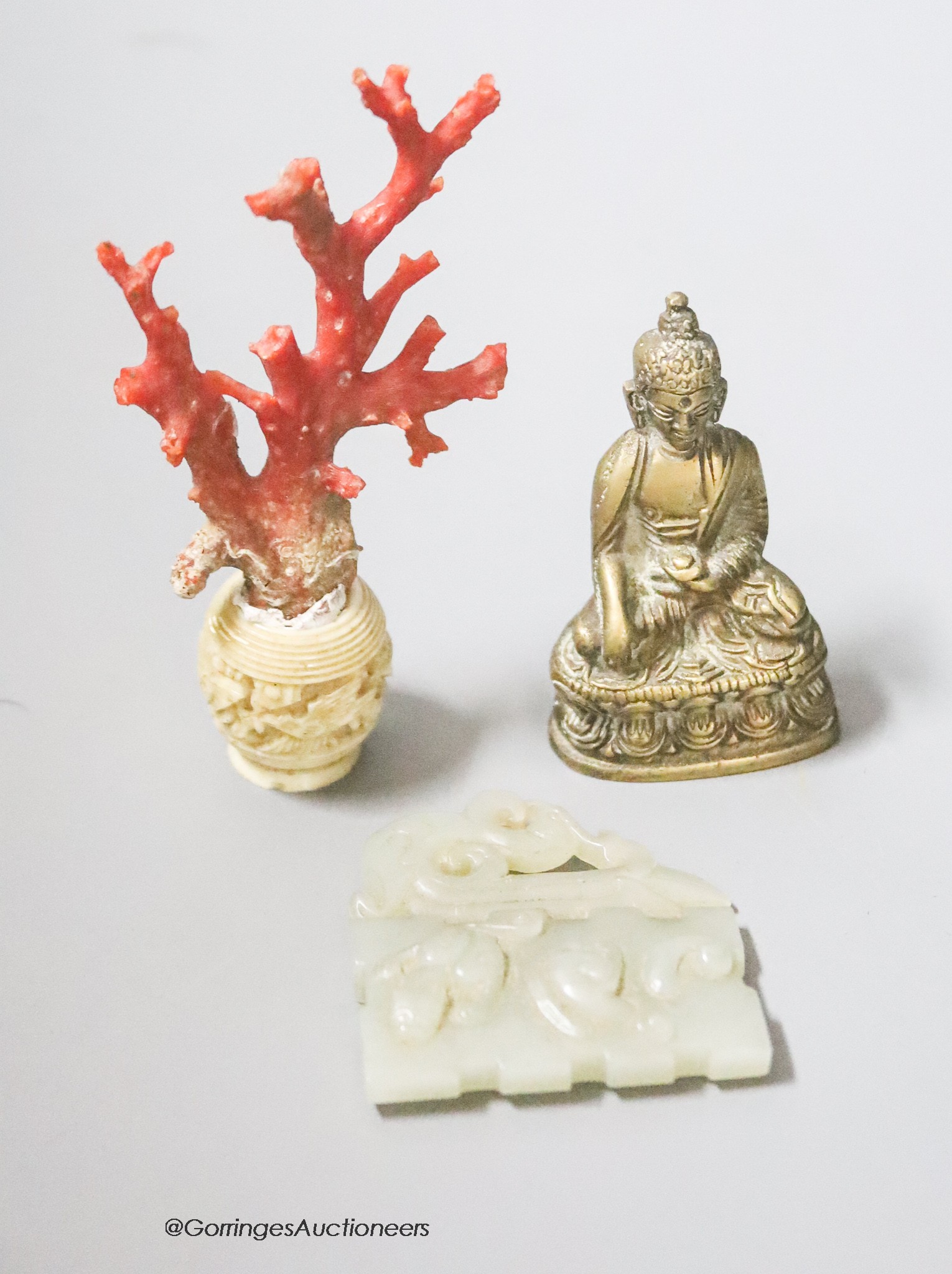 A coral and ivory miniature carving, height 9cm, a Buddha and a carved jade plaque                                                                                                                                          