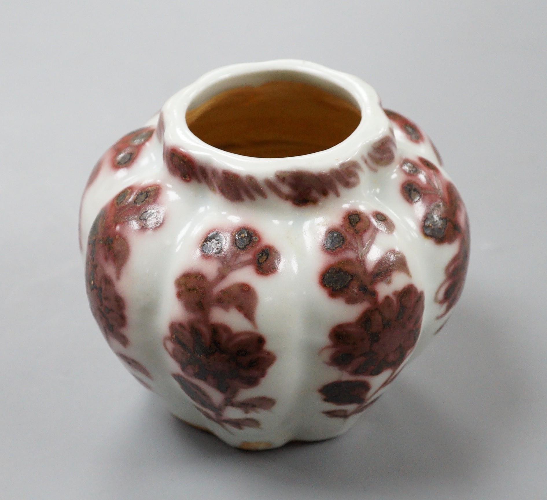 A Chinese underglaze copper red lobed jar, 9cm tall                                                                                                                                                                         