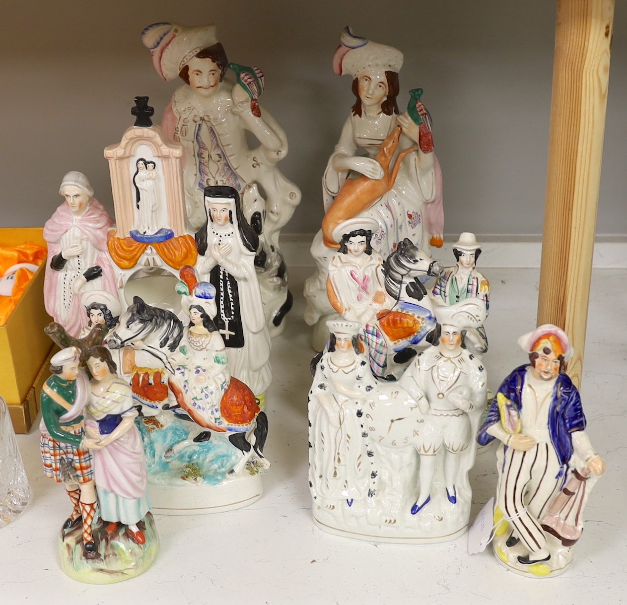 A collection of eight Victorian Staffordshire figures or groups, largest 36cm                                                                                                                                               