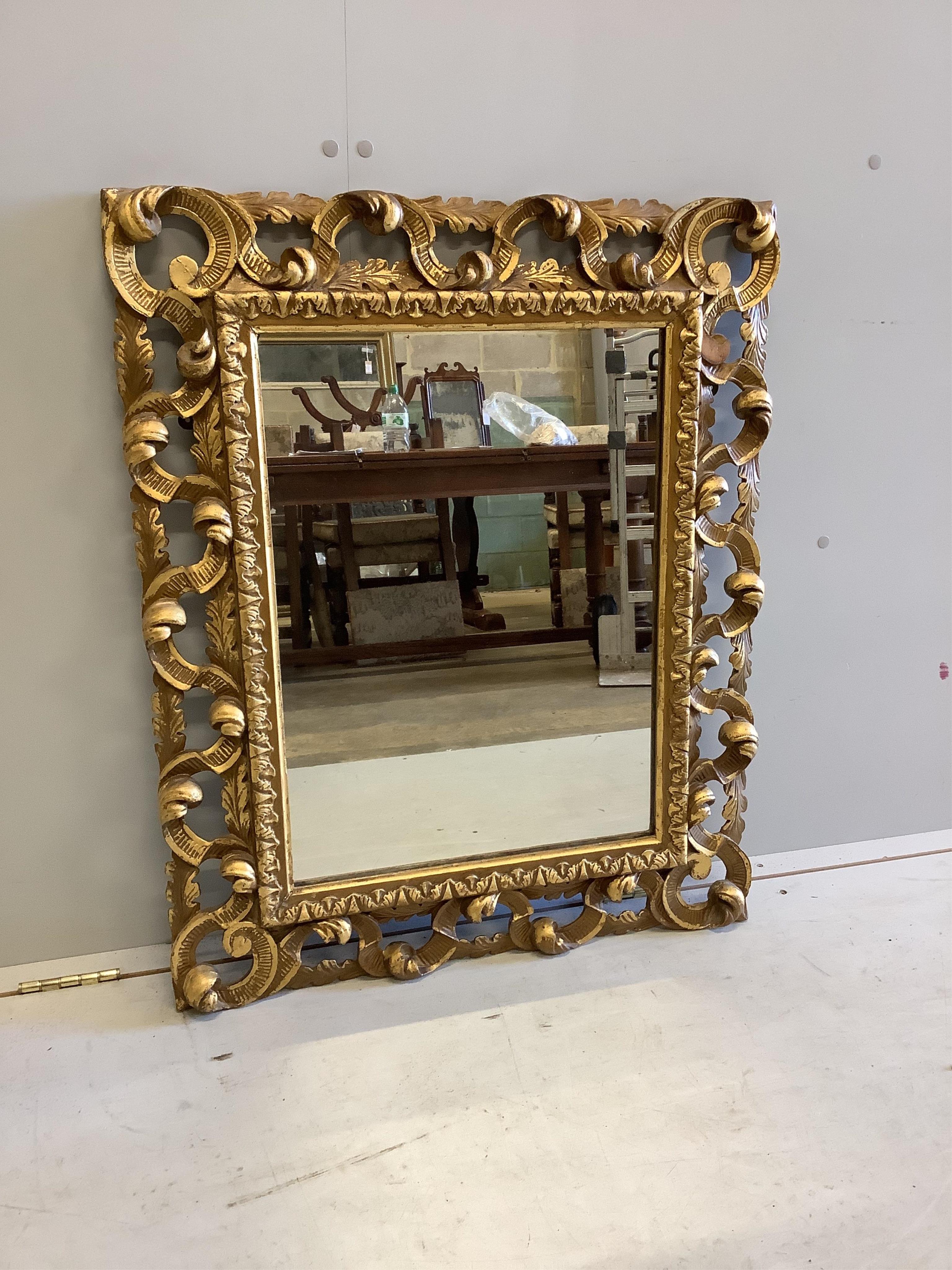 A giltwood Florentine style mirror, width 70cm height 86cm . Condition - fair                                                                                                                                               