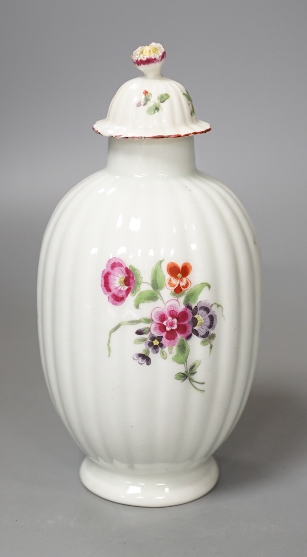 A Worcester tea canister and rare cover painted with flowers on a fluted body c.1770. 16.5cm                                                                                                                                