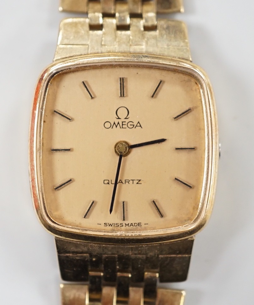 A lady's 9ct gold Omega quartz wrist watch, on a 9ct gold Omega bracelet, overall 17.3cm, gross weight 29 grams, with Omega box and booklet.                                                                                