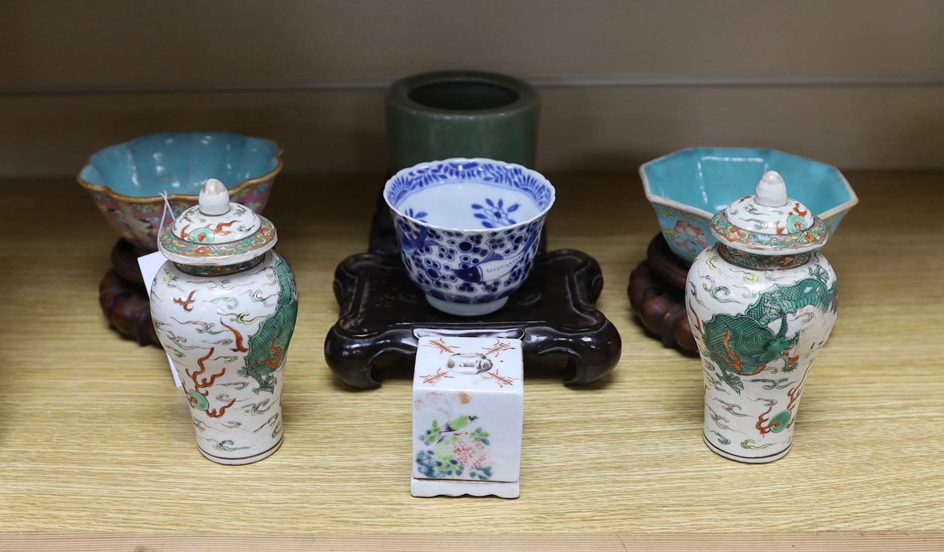 A group of 19th century Chinese ceramics, tallest 13cm, including a pink ground crane dish, 12cm diameter of a pair of small crackle glaze ‘dragon’ vases and covers, an incense burner and square cover, c.1900 etc.       