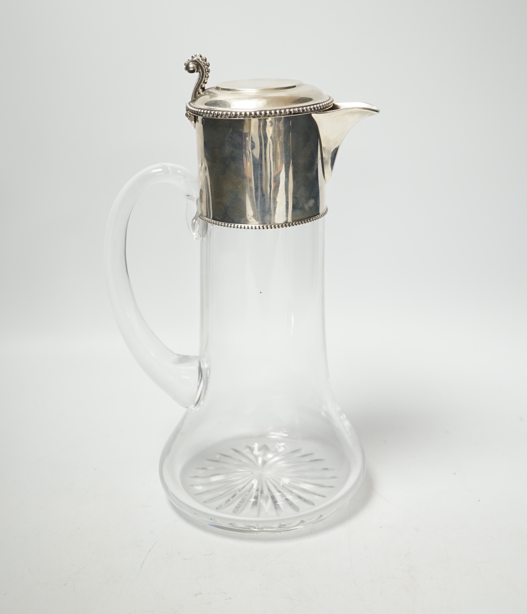 A Victorian silver mounted glass claret jug, John Wilmin Figg, London, 1868, 26.7cm.                                                                                                                                        