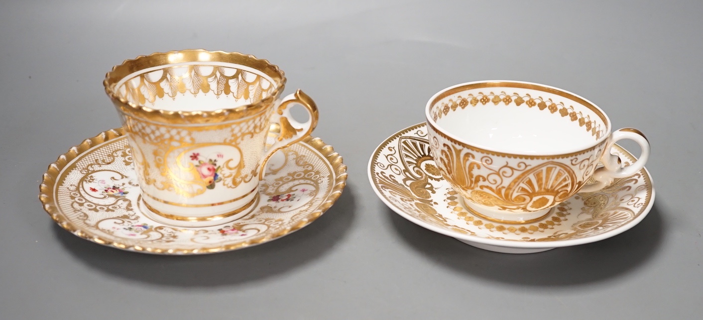 A Chamberlains Worcester gadroon bordered coffee cup and saucer painted with flowers, printed mark in puce and a Spode teacup and saucer with raised gilding in neo-classical style pattern 4327, mark and pattern in red   
