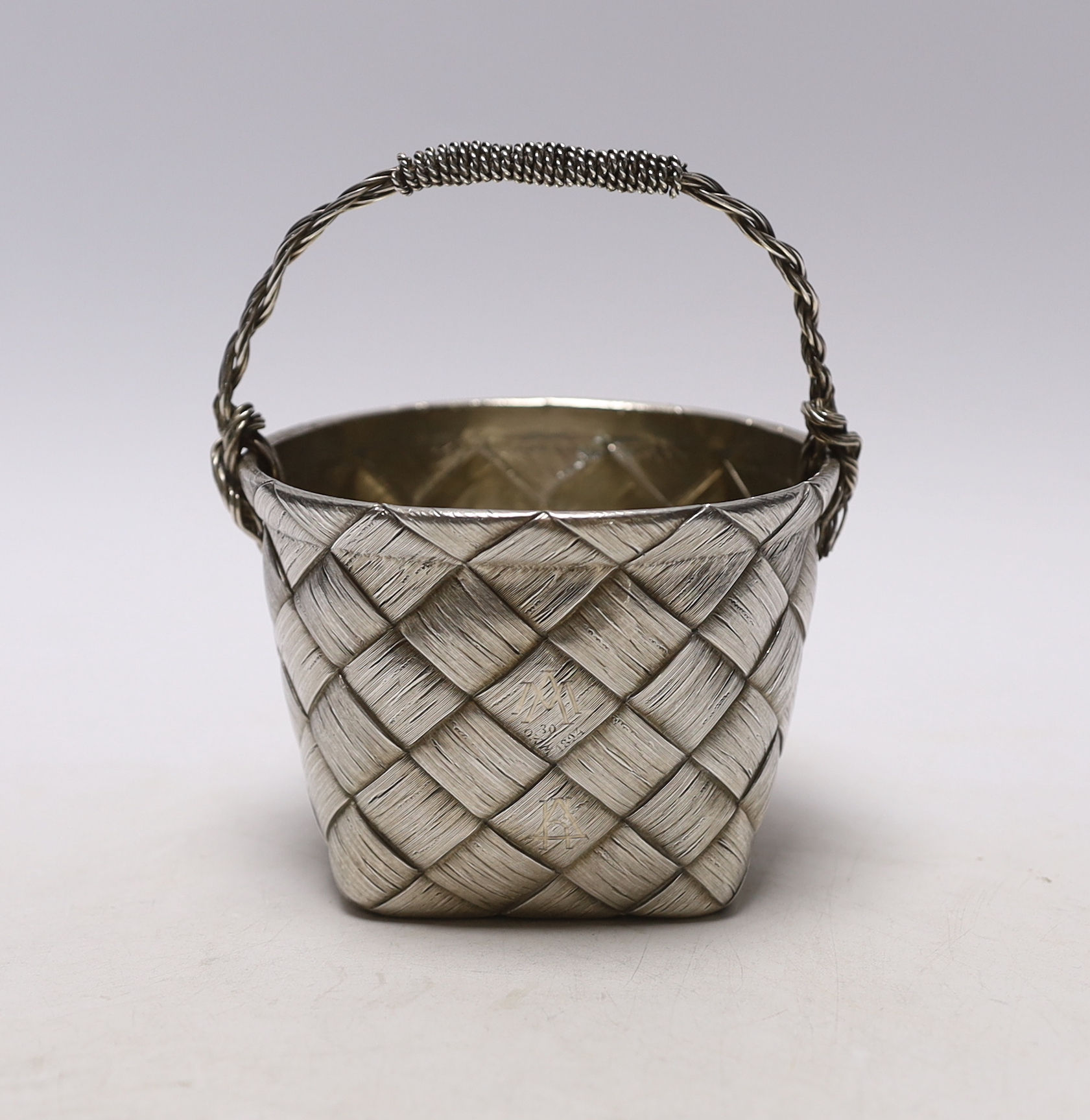 A late 19th century Russian 84 zolotnik ‘basket’ bowl, master Gavril Gratchev (with later handle?), width 10.3cm, gross weight 10oz.                                                                                        