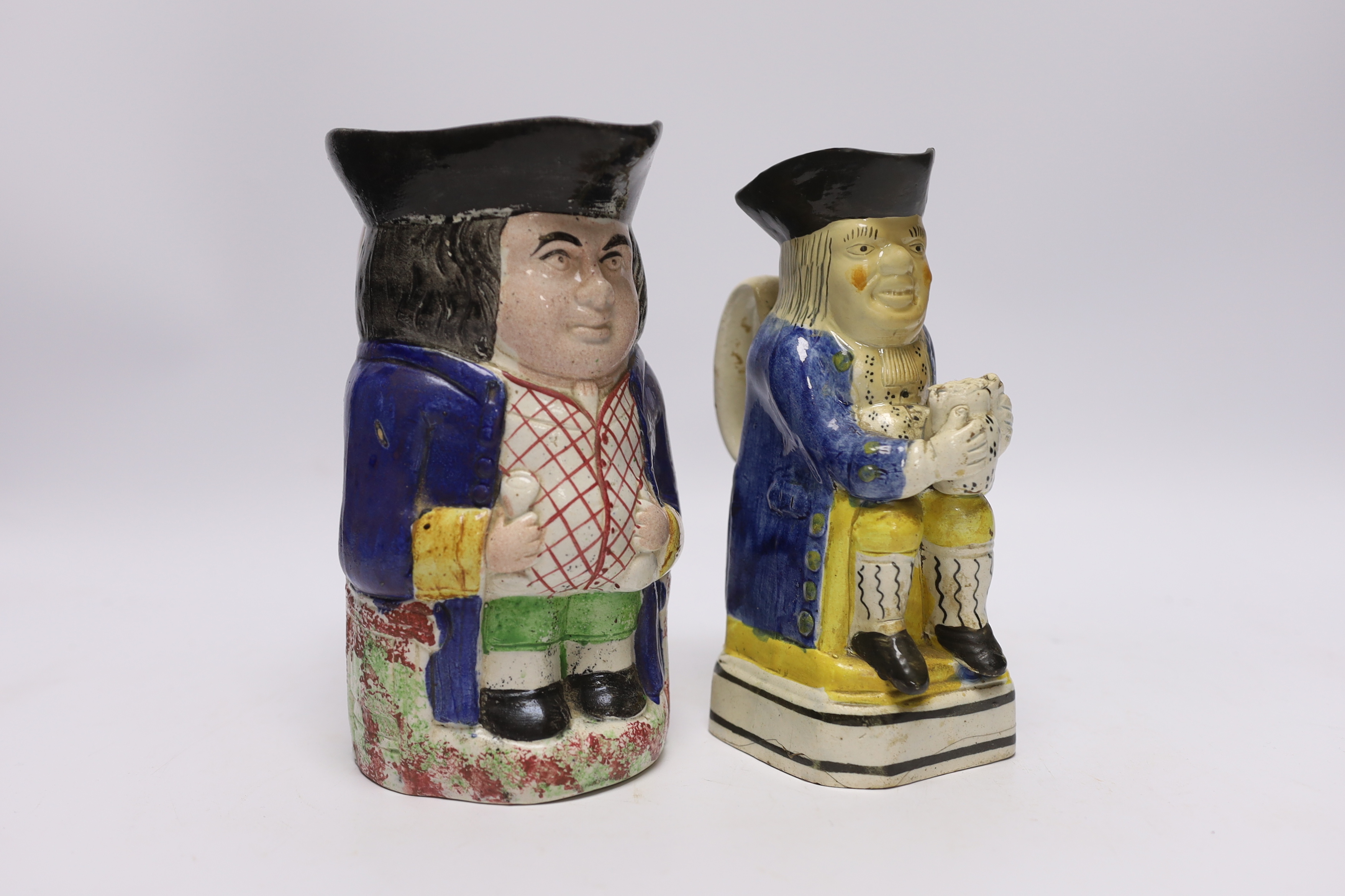 A pearlware Toby jug, c.1795 and late 19th century Staffordshire Toby jug, tallest 19cm                                                                                                                                     