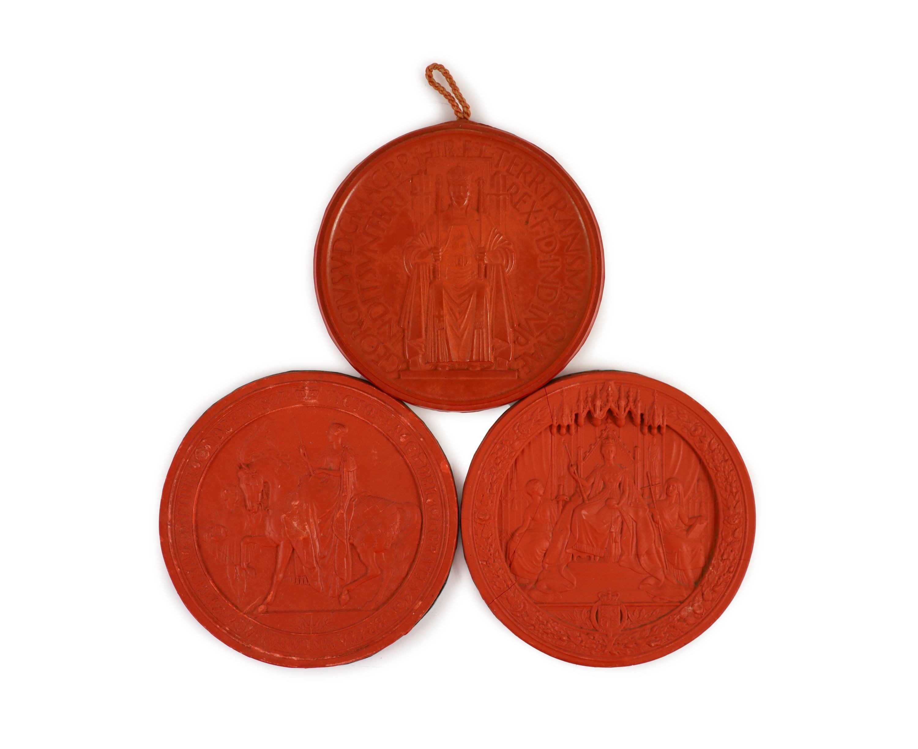Three red wax Great Seals, two Queen Victorian Great Seals of the Realm, and a George V seal, 16.5 and 16 cm diameter                                                                                                       