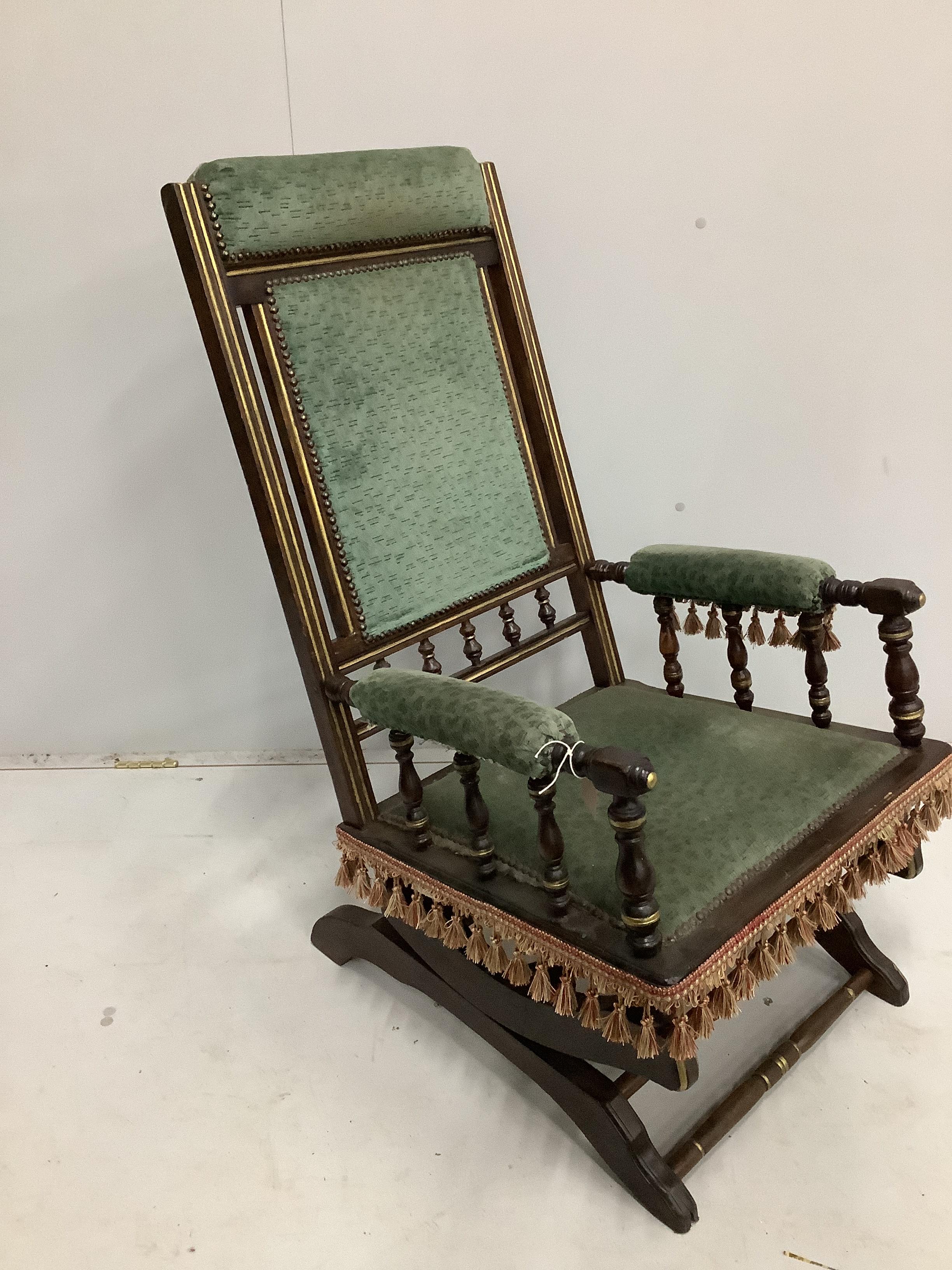 A 19th century American mahogany rocking chair, width 58cm, depth 54cm, height 100cm                                                                                                                                        
