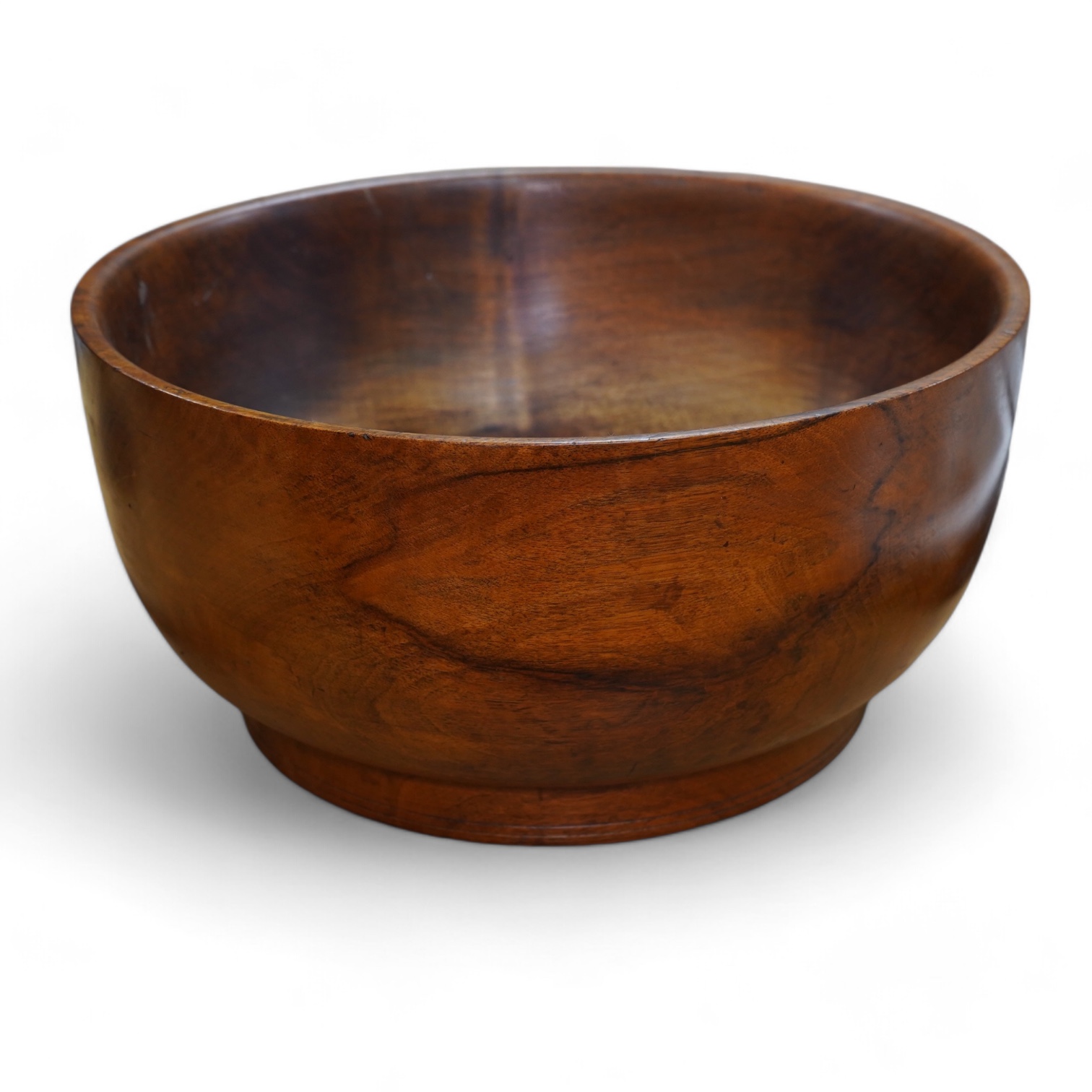 A large turned walnut bowl, carved from the solid, 38cm diameter. Condition - good                                                                                                                                          