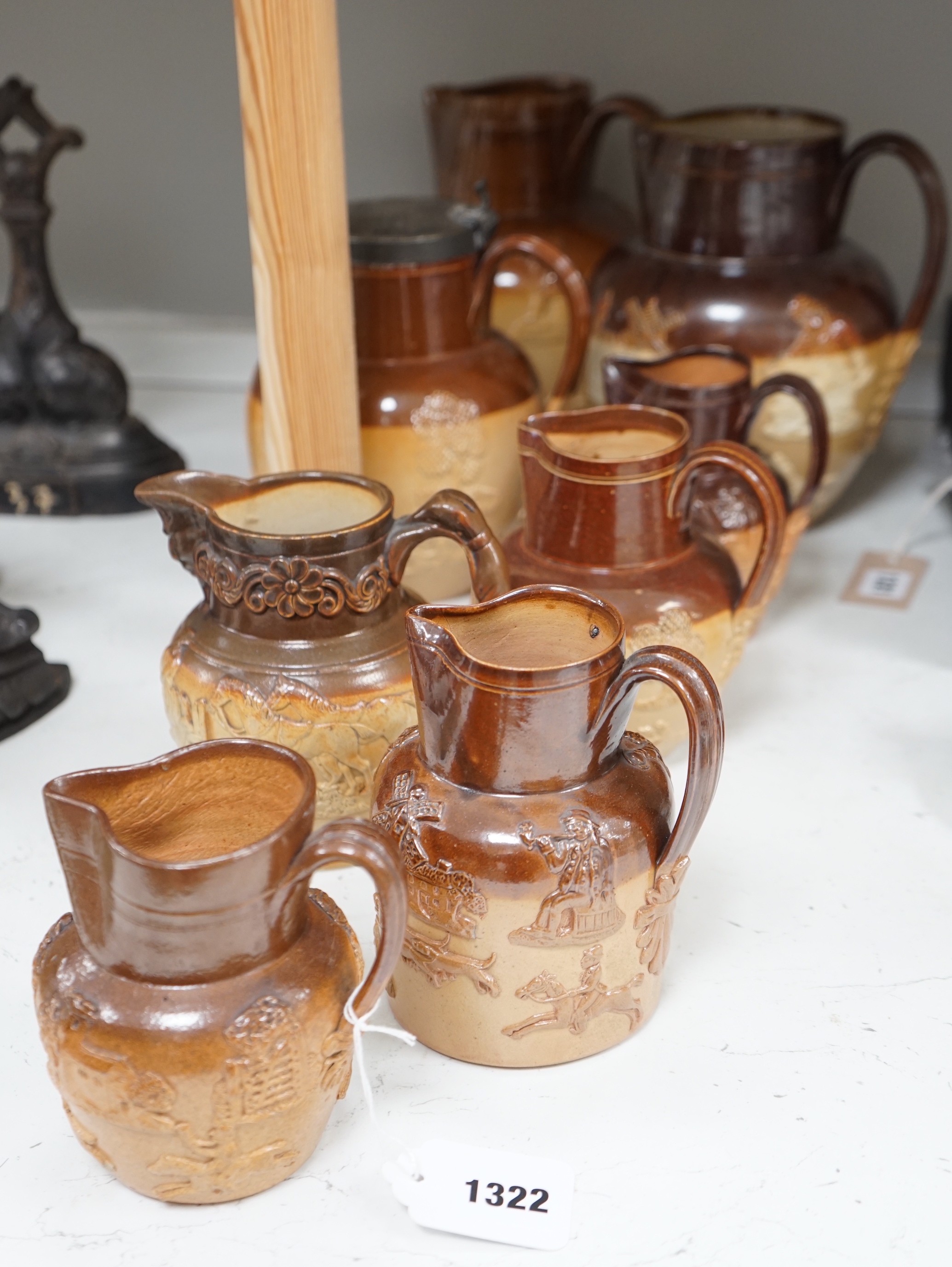 A group of eight Fulham & Lambeth salt-glazed stoneware jugs, tallest 22cm                                                                                                                                                  