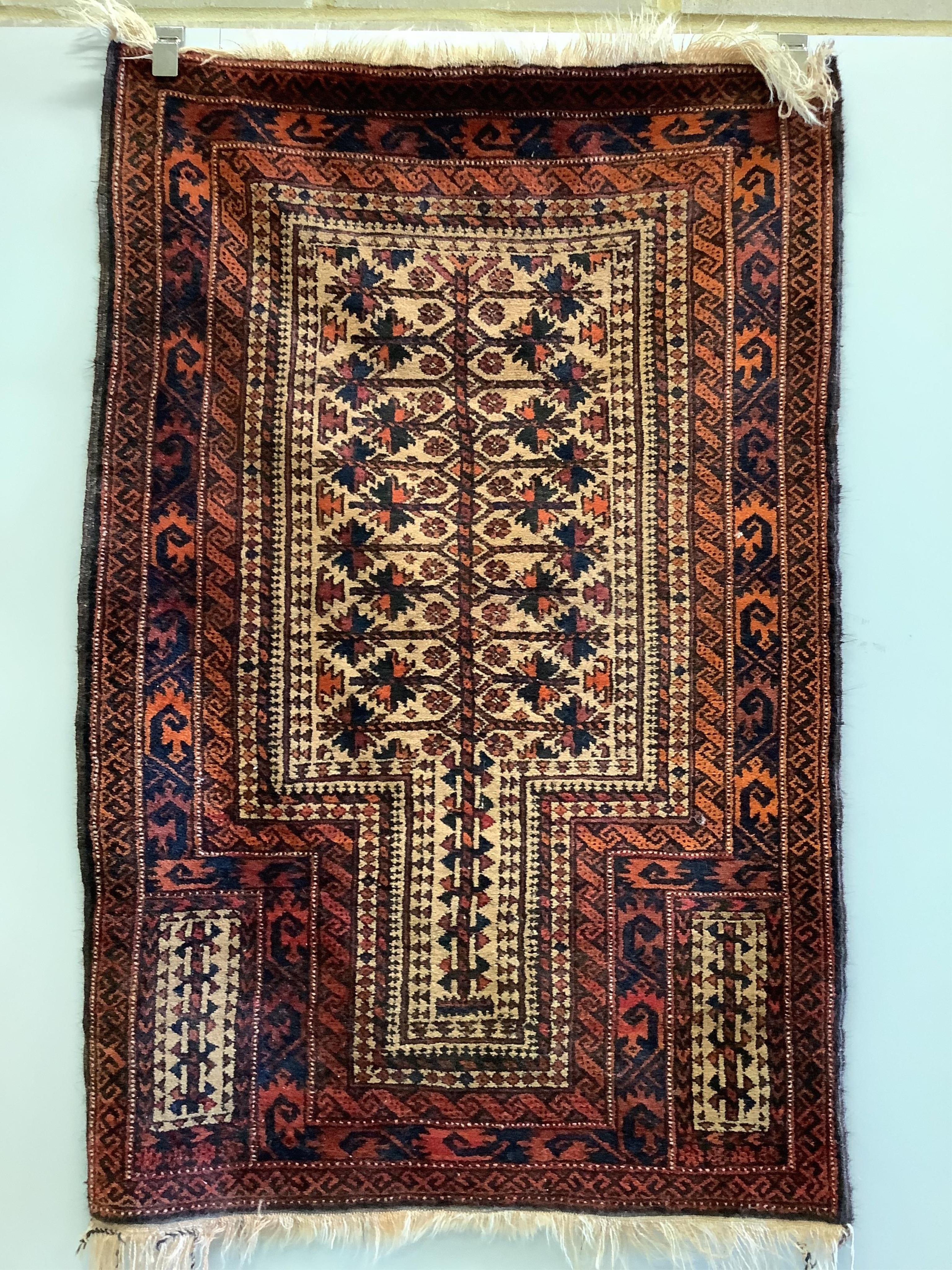 A Belouch red ground prayer rug, 142 x 96cm. Condition - fair                                                                                                                                                               