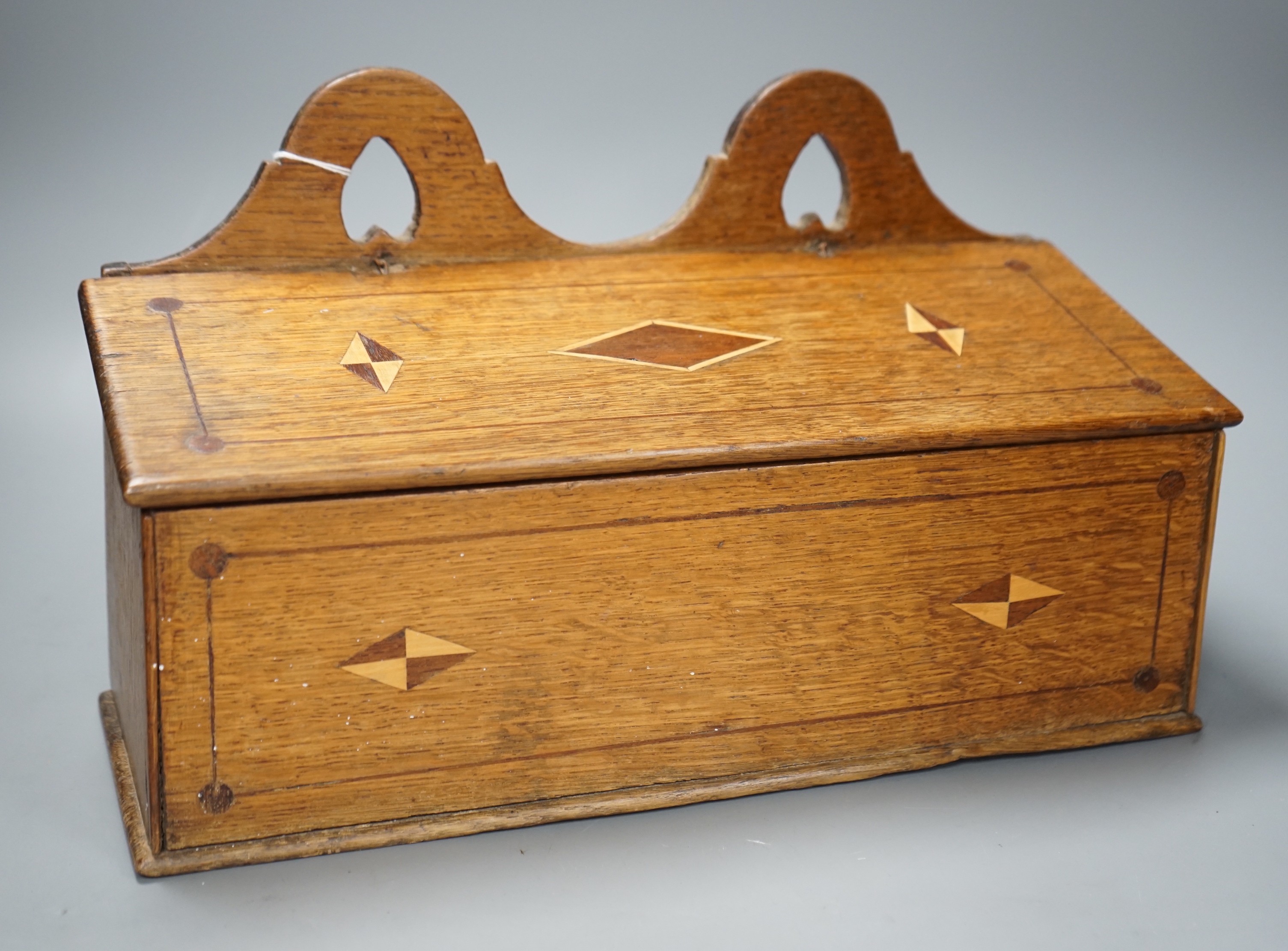 A George III inlaid oak candle box, 38cm wide                                                                                                                                                                               