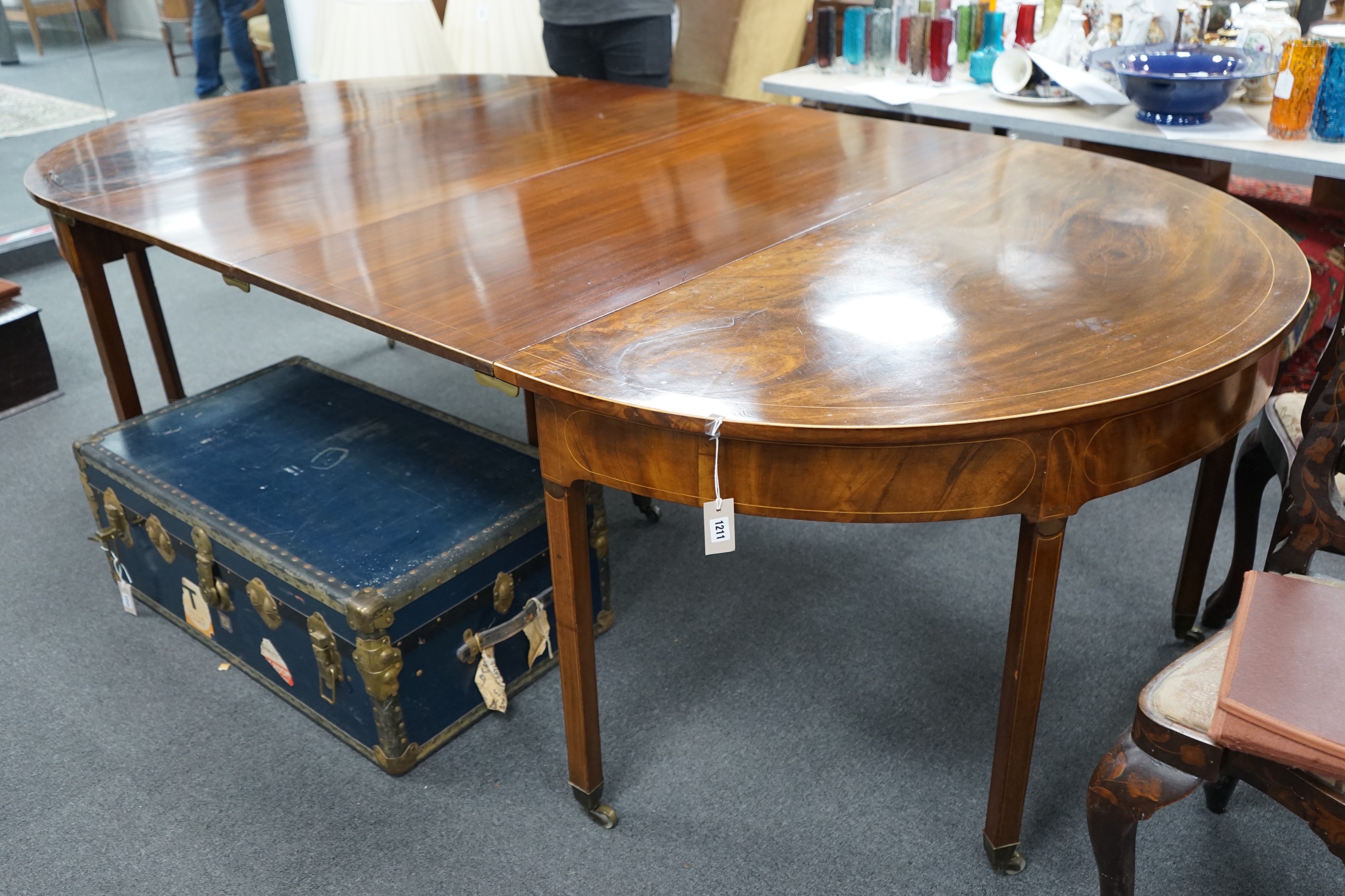 A George III, possibly Irish, mahogany D end extending dining table, length 190cm, 260cm extended, two spare leaves, width 136cm, height 76cm                                                                               