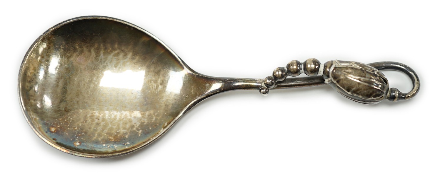 A George VI Georg Jensen silver blossom pattern caddy spoon, import marks for 1948, no.84, 10.2cm.                                                                                                                          