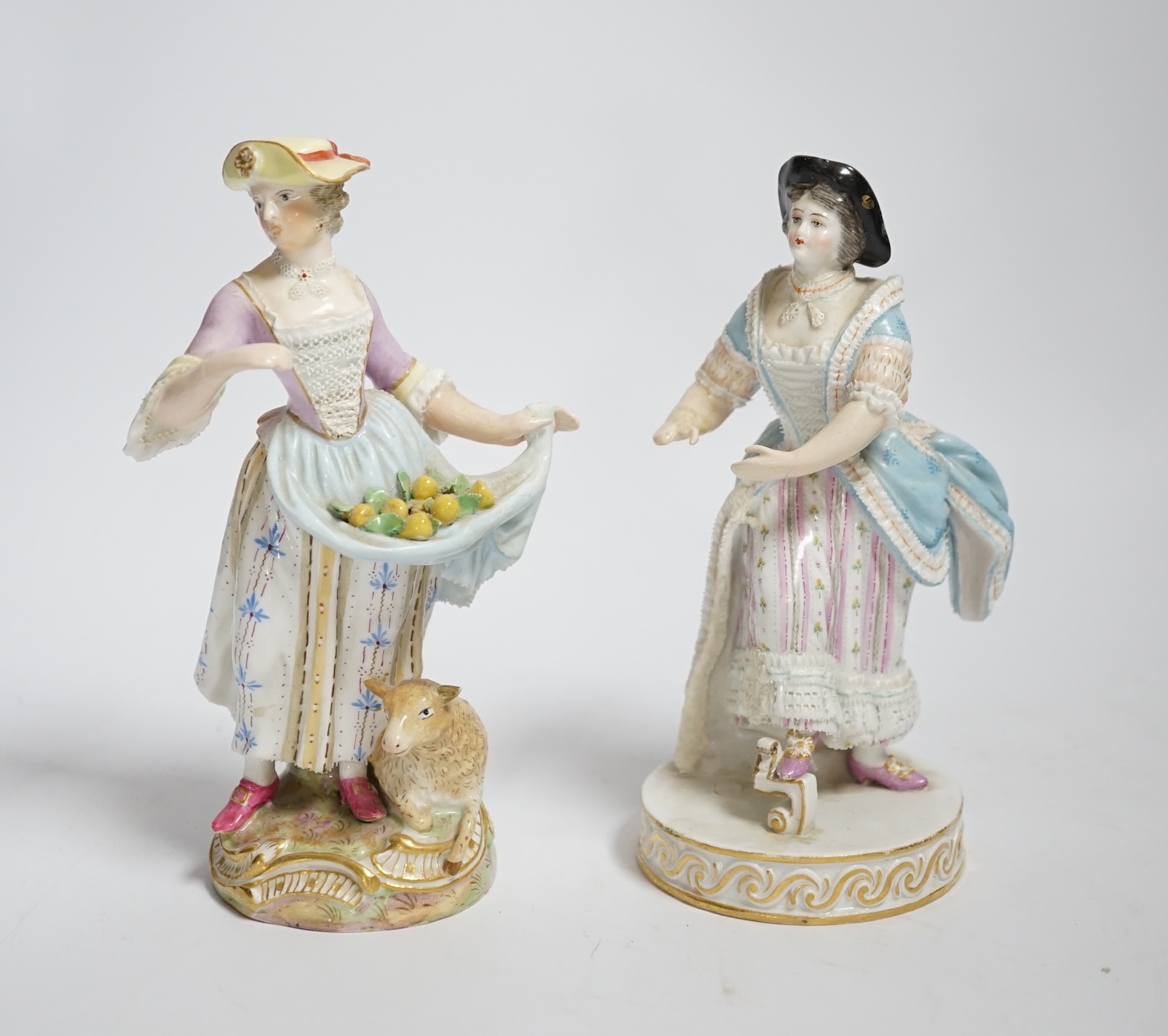 A late Meissen porcelain figure of a young woman wearing a black jacket and floral skirt on circular base, height 15cm and another similar figure (both with restored arms and hands), 15cm high                            