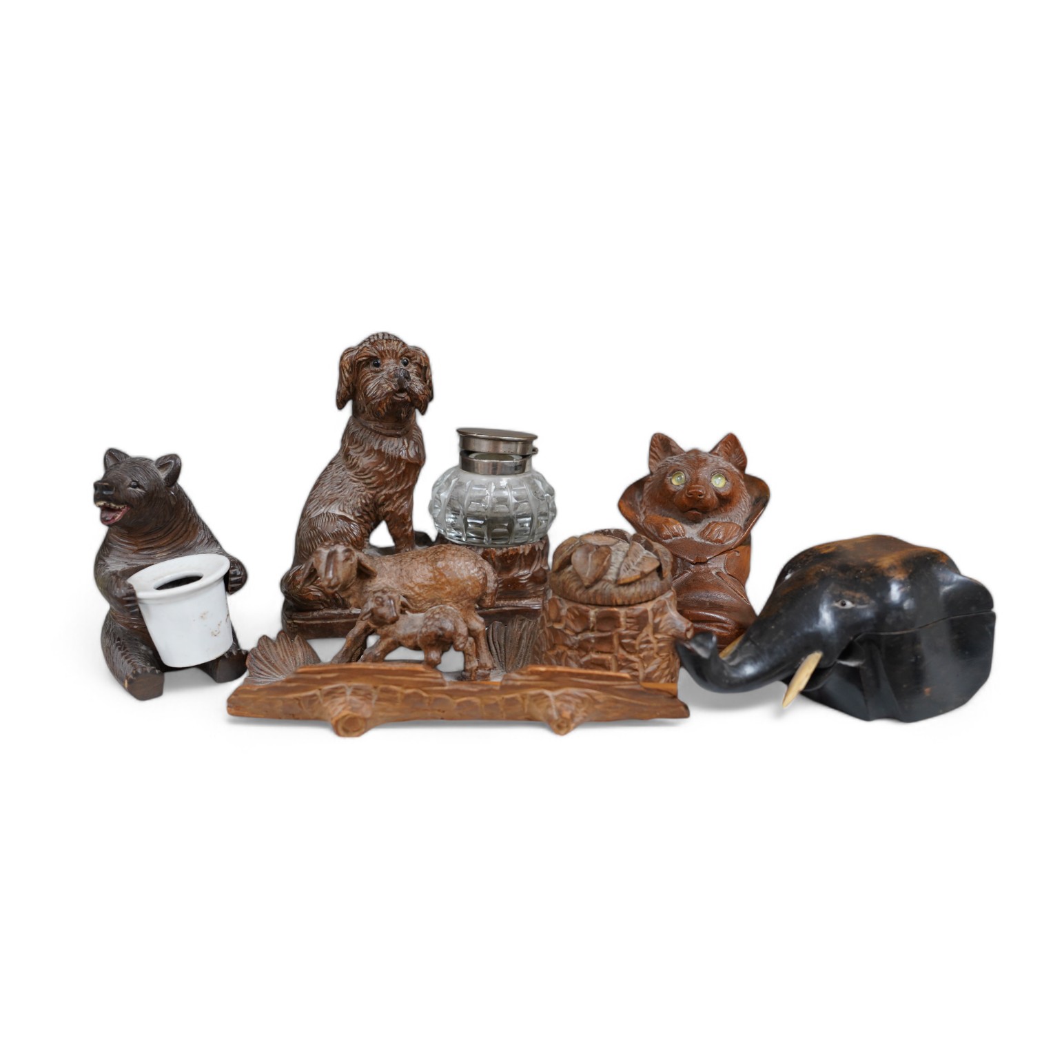 A collection of five carved wooden novelty animal inkwells, four black forest, tallest dog inkwell 15cm high. Condition - some small chips but fair                                                                         