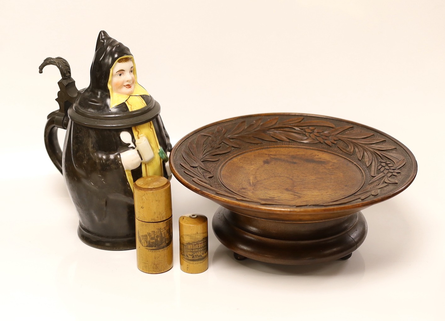 A continental figural lidded jug a carved treen comport and two Mauchline boxes, jug 21cms high                                                                                                                             