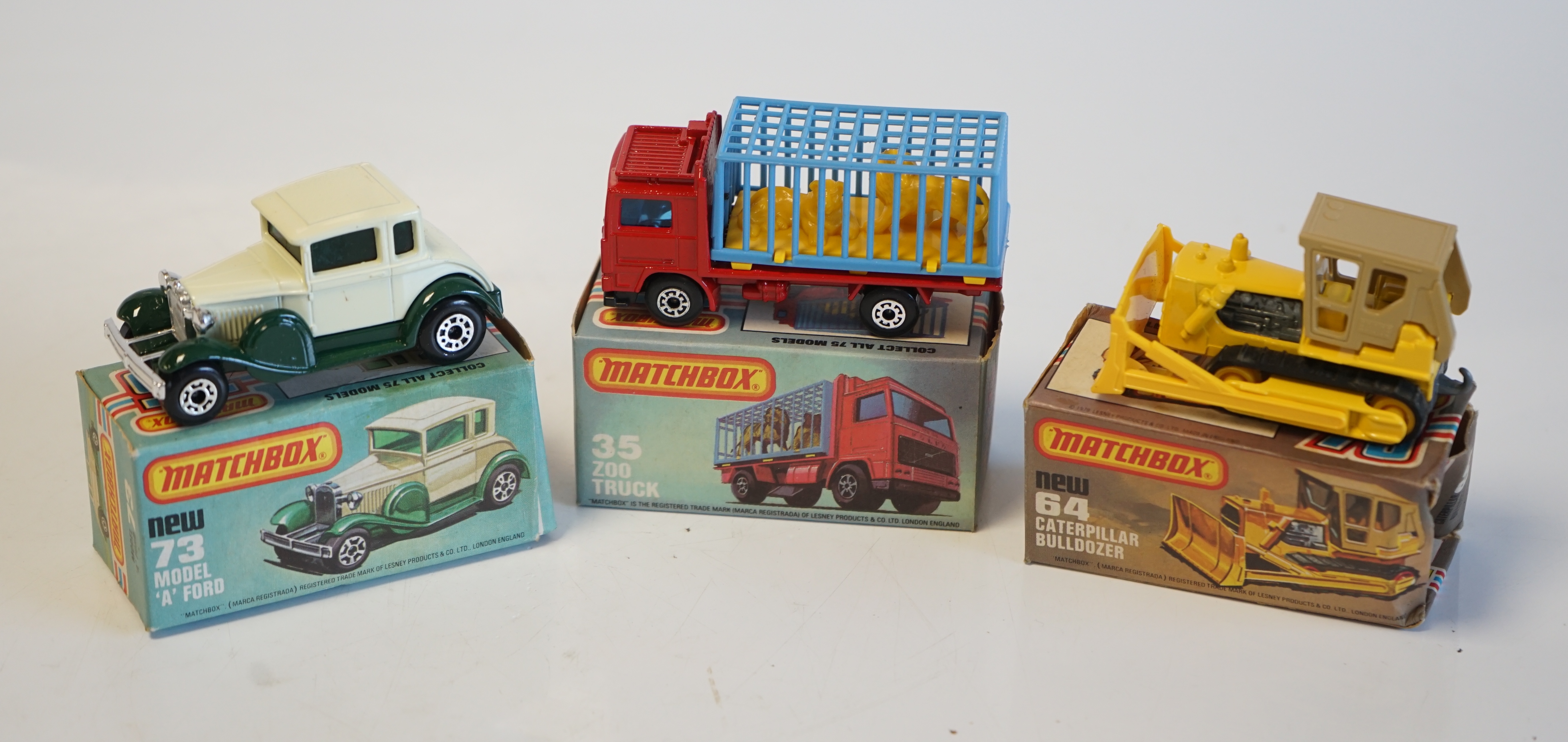 Sixteen boxed Matchbox Series 1-75 diecast vehicles including; 1; Dodge Challenger, 14; Petrol Tanker, 28; Formula Racing Car and another, 34; Chevy Pro Stocker, 35; Zoo Truck and another, 52; Police Launch, 61; Wreck Tr