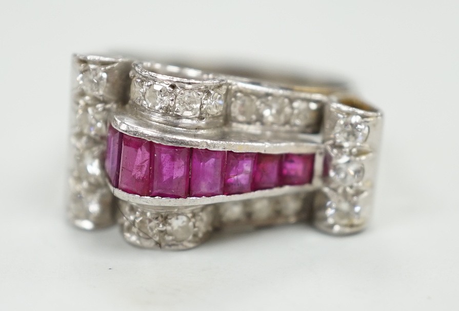 A 1950's? white metal, graduated ruby and diamond cluster set cocktail ring, size Q, gross weight 9.1 grams.                                                                                                                