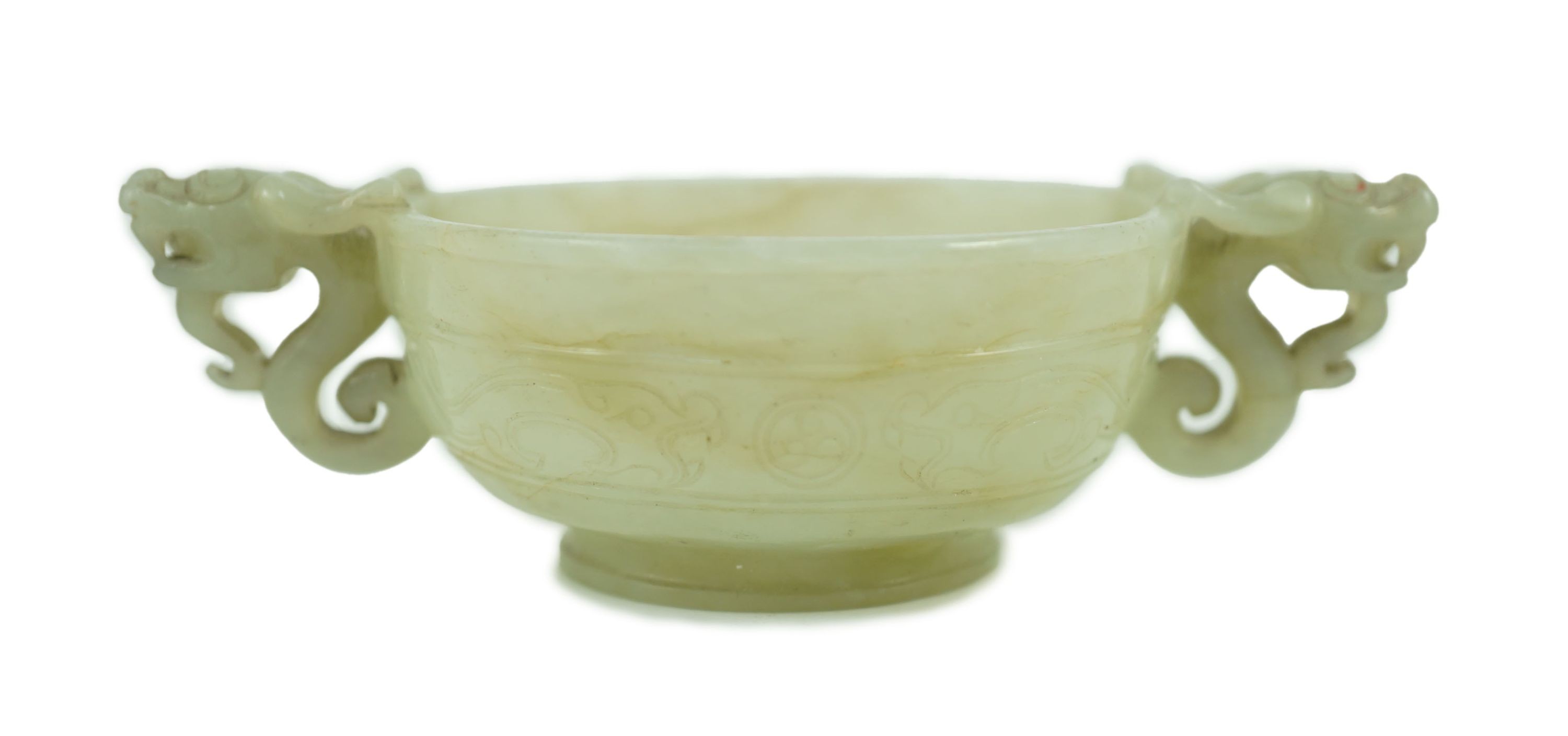 A Chinese pale celadon jade two handled ‘chilong’ cup, 17th/18th century, 13.2cm wide                                                                                                                                       