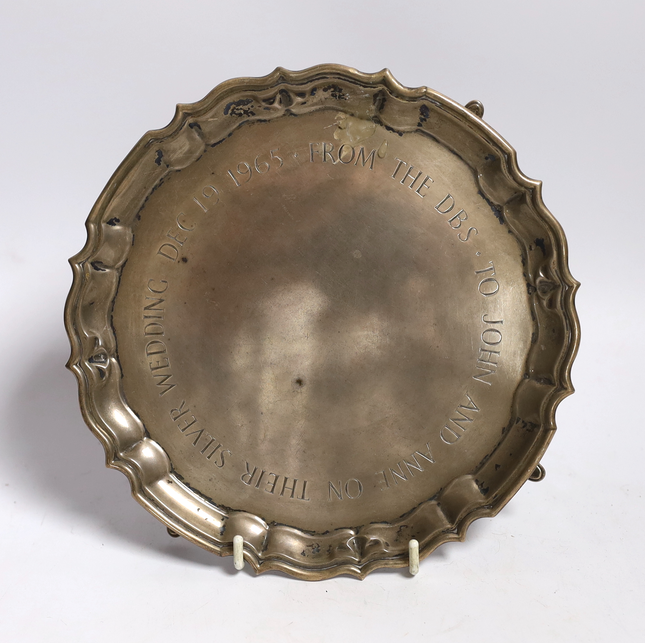 A small George V presentation silver waiter with later central script ‘To John and Ann on their silver wedding Dec 1965 from the DBS’ London, 1919 by Carrington & Co, 20.9cm, 10.7oz.                                      