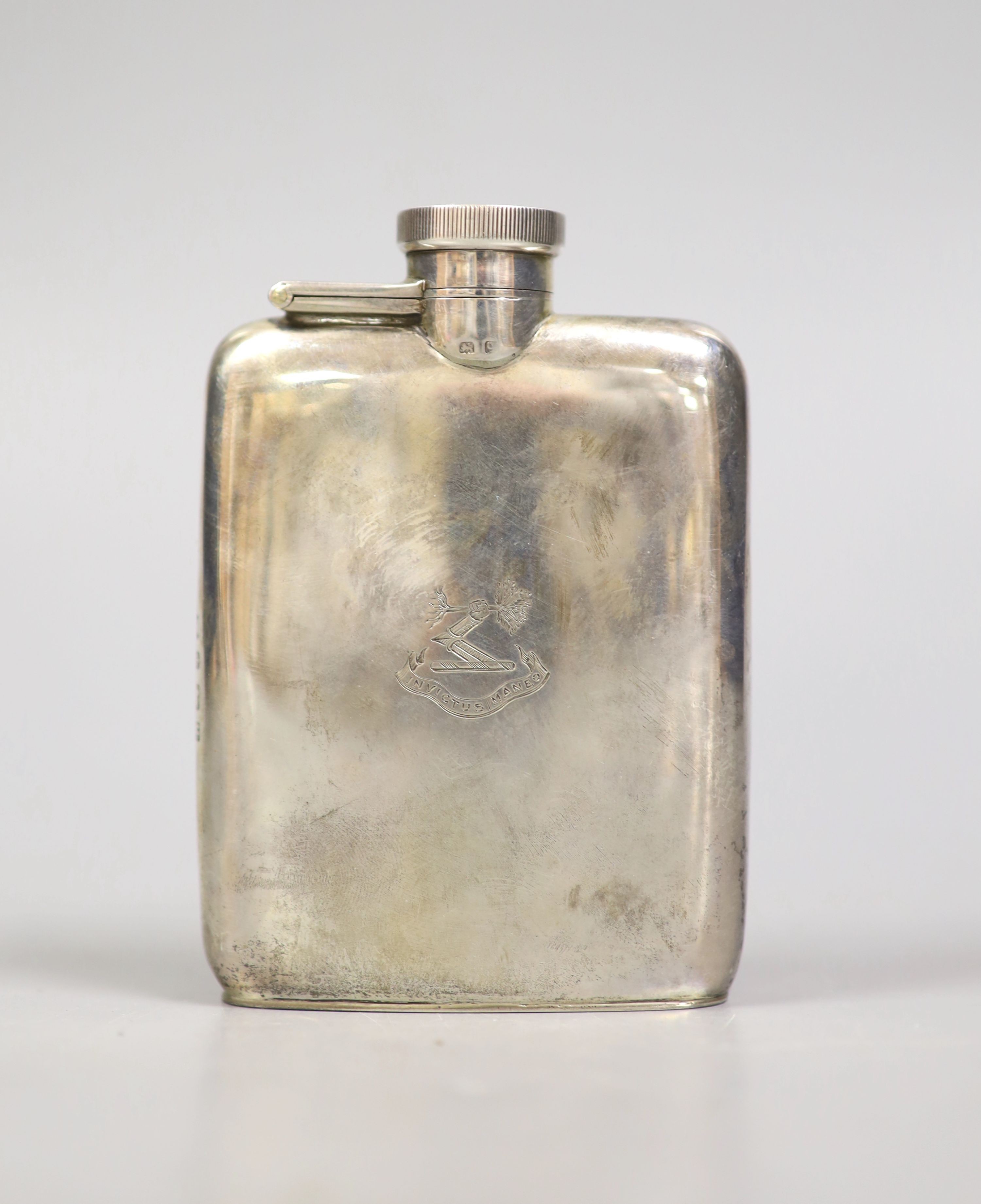 A George V silver hip flask, Birmingham, 1915, 10.1cm, 117 grams.                                                                                                                                                           