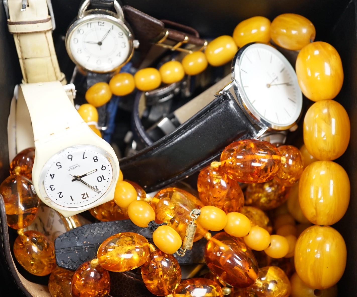 A quantity of assorted gentleman's modern wrist watches and two necklaces including amber style.                                                                                                                            