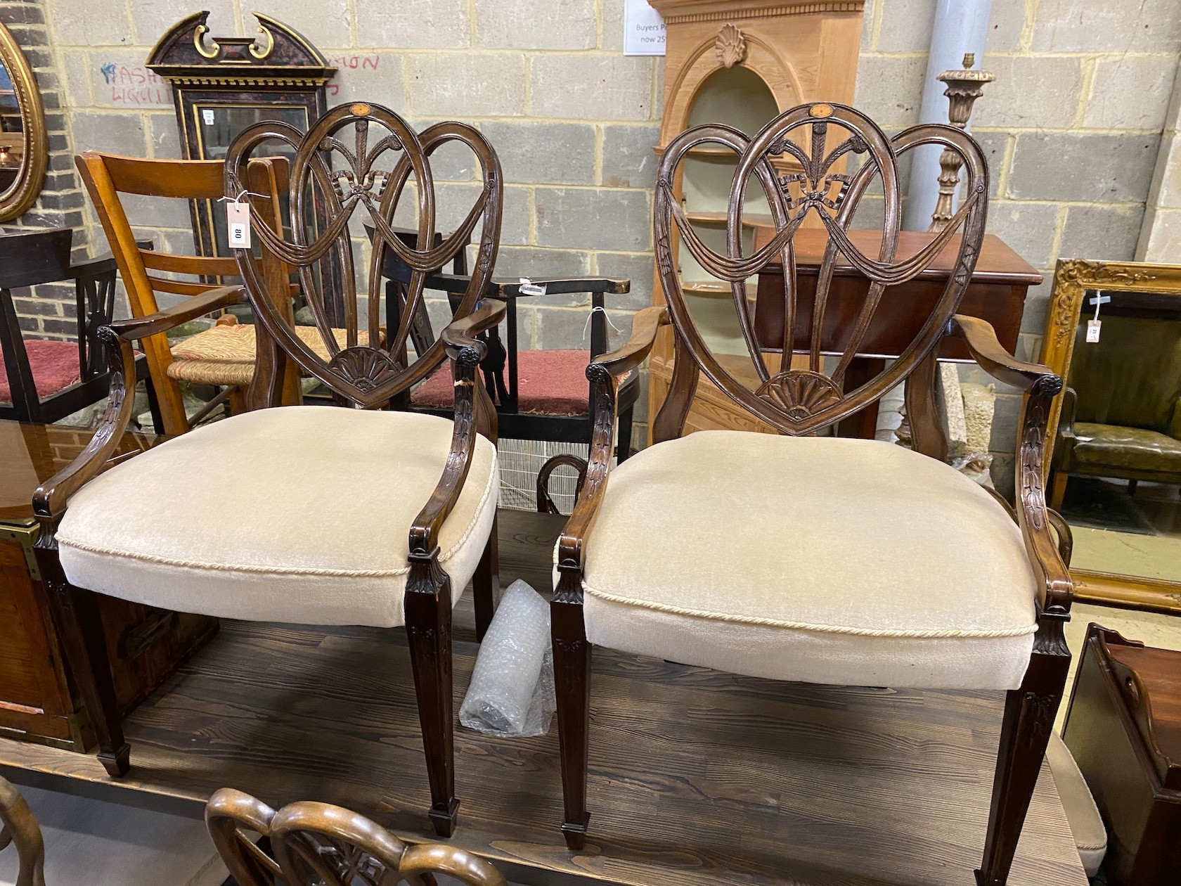 A set of eight Hepplewhite style mahogany dining chairs, two with arms                                                                                                                                                      